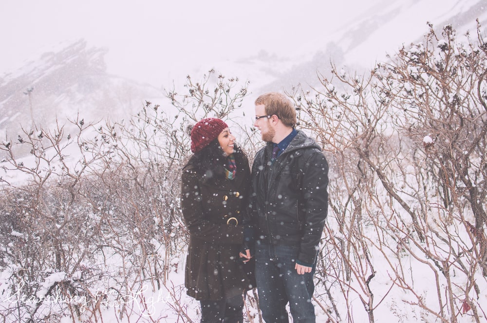 winter engagement photos at Red rocks by Denver wedding photographer searchingforthelight.com