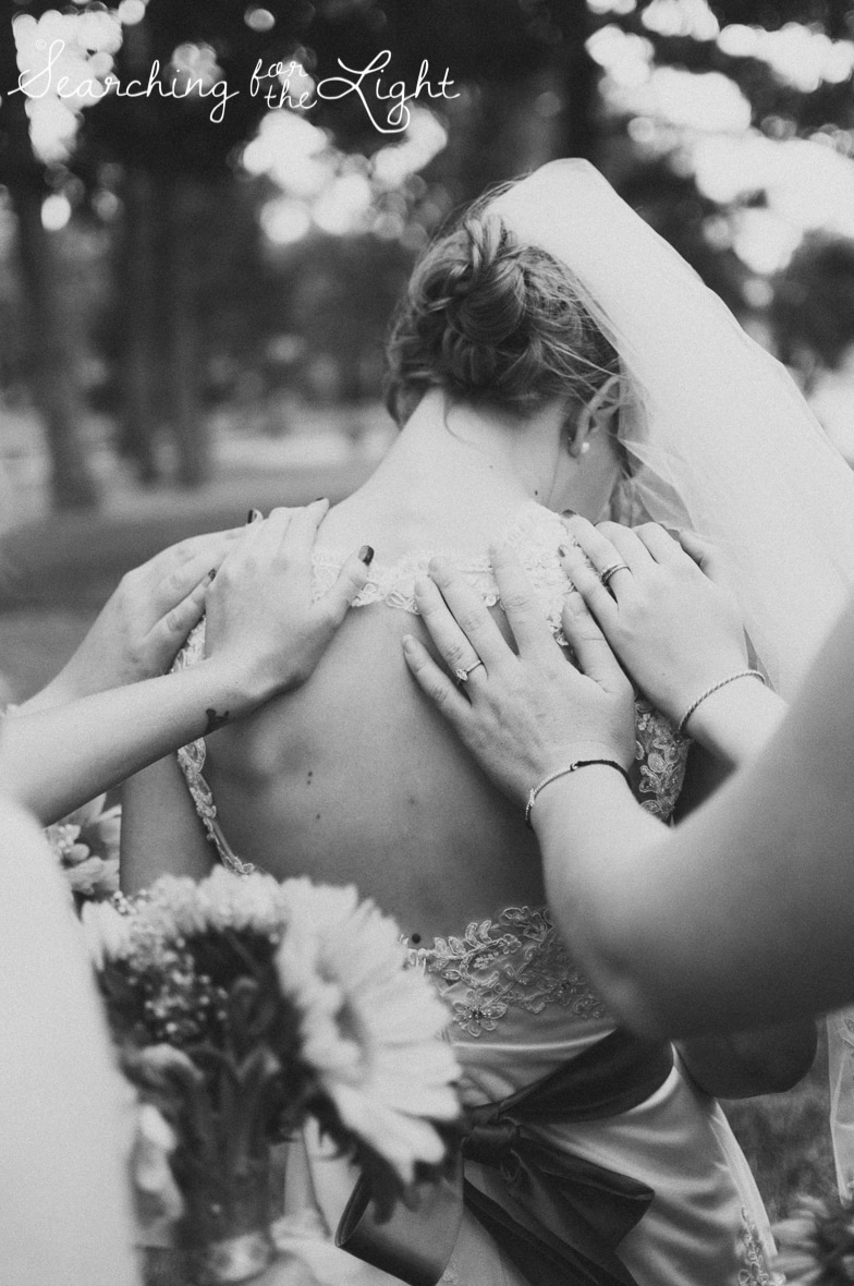 Praying Before Your Wedding Ceremony:  Wedding Tips from a professional Denver Wedding Photographer featuring photos of prayer before a wedding ceremony.