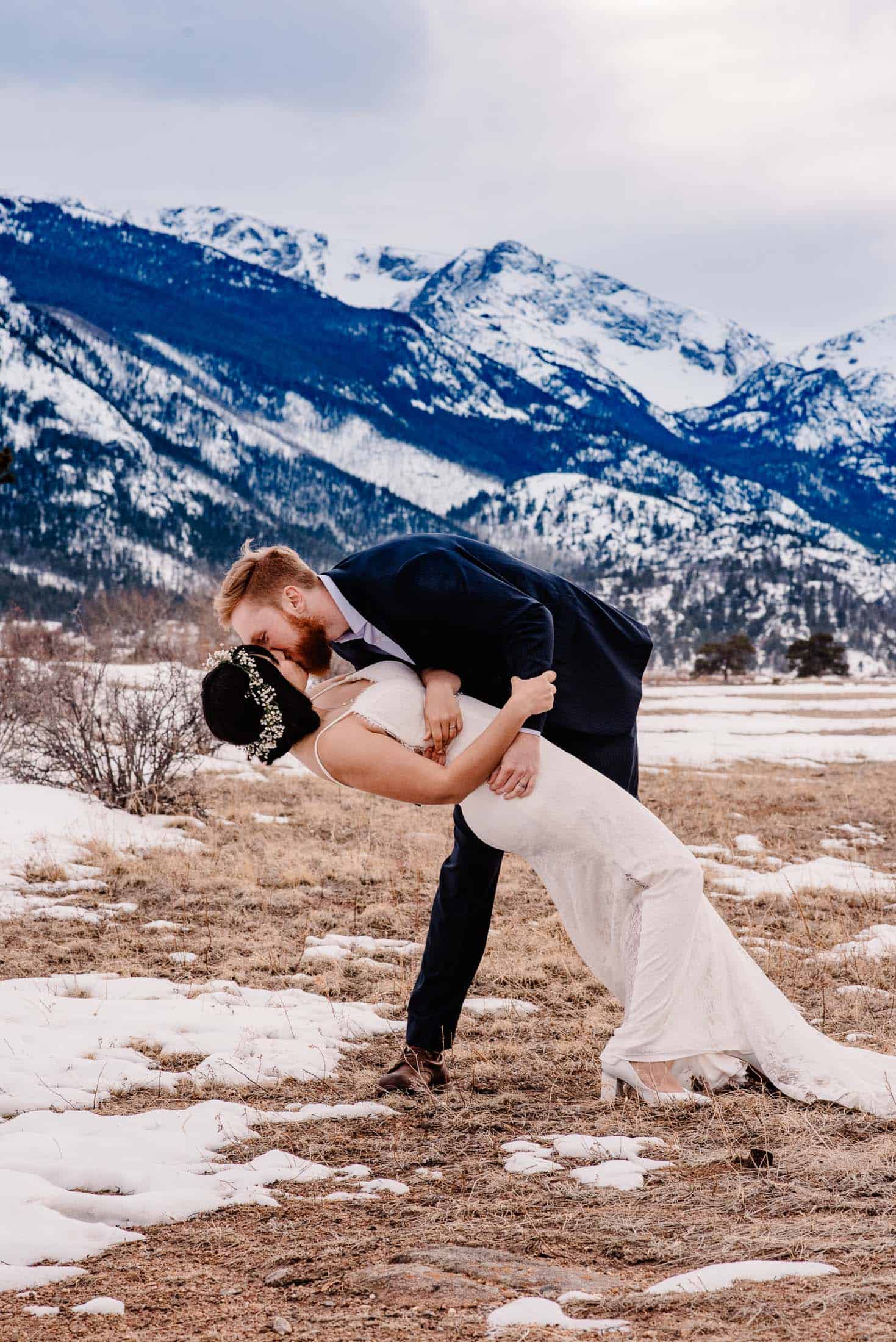 couple kissing in a colorado mountain meadow