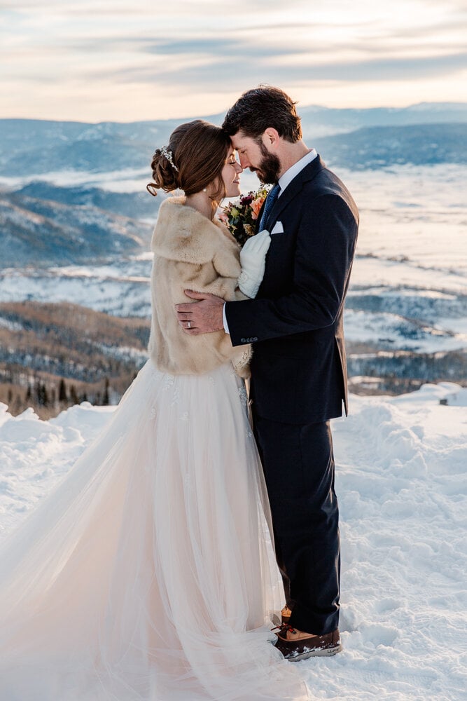 bride and groom on a mountain top