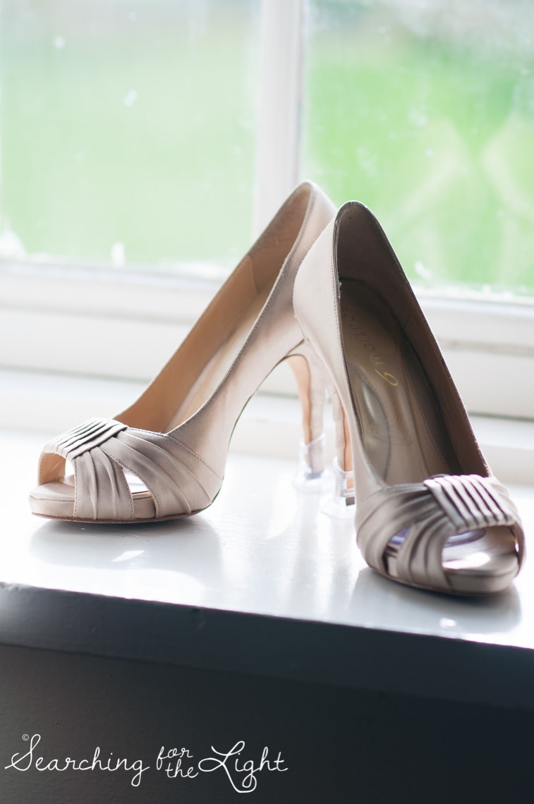 wedding shoes in a window Lakewood stone house wedding photos by Denver wedding photographer searchingforthelight.com