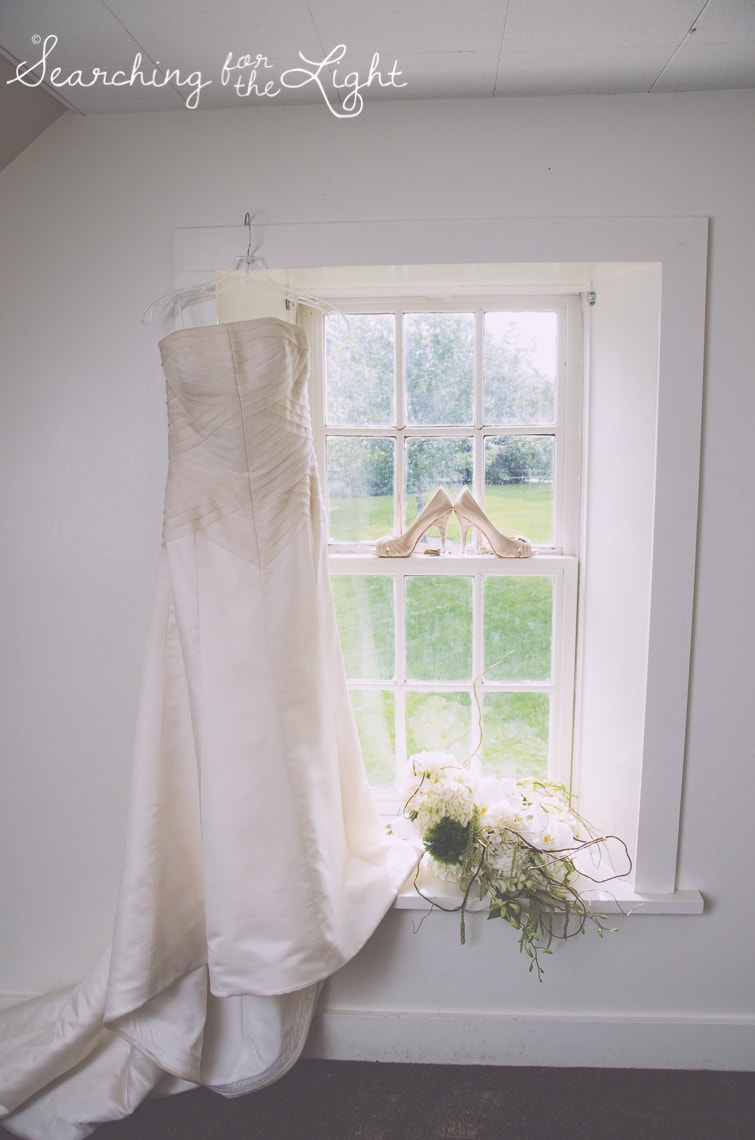 wedding clothes in a window Lakewood stone house wedding photos by Denver wedding photographer searchingforthelight.com