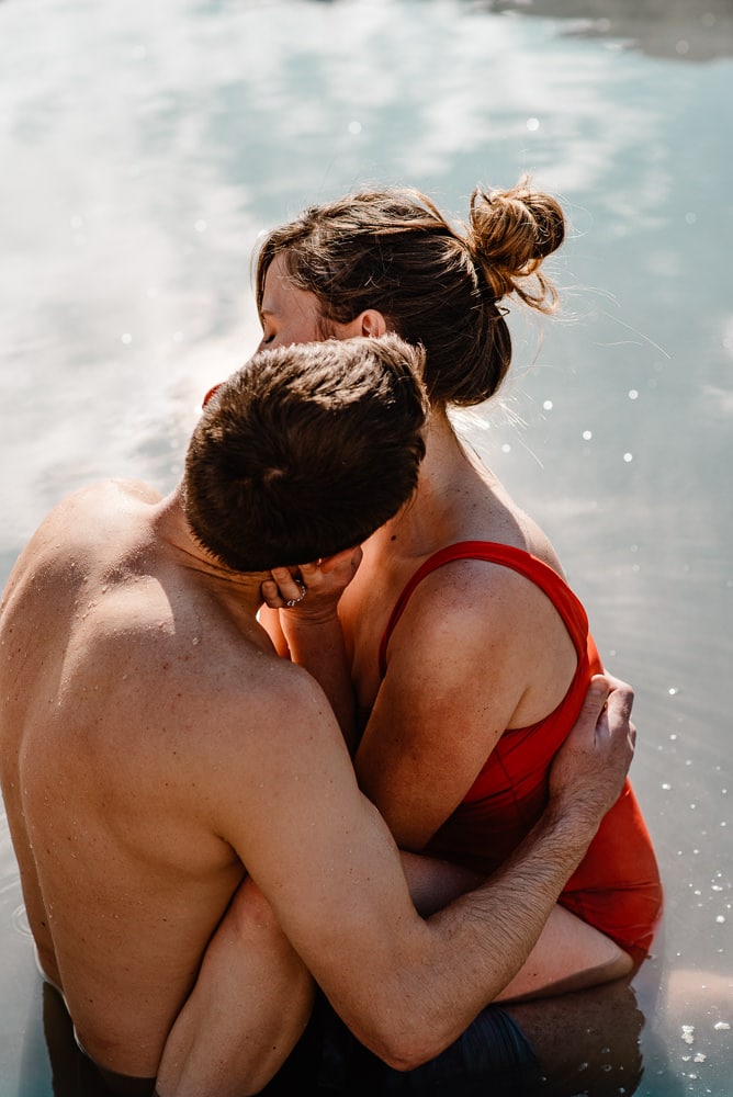Couple cuddling in water