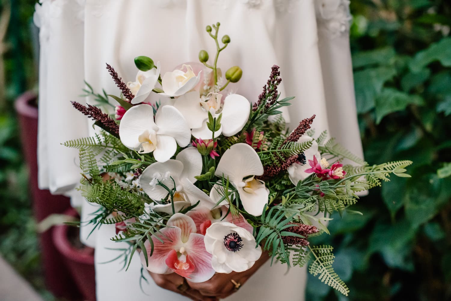 bride holding silk flowers