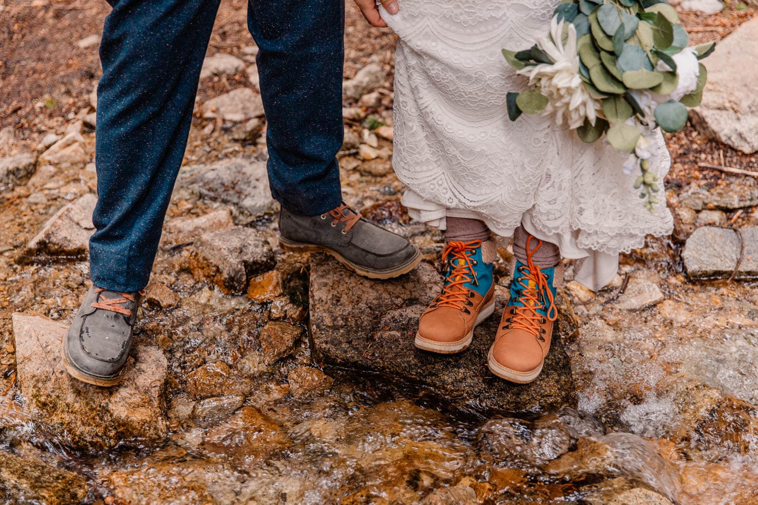 couple on their wedding day showing their shoes