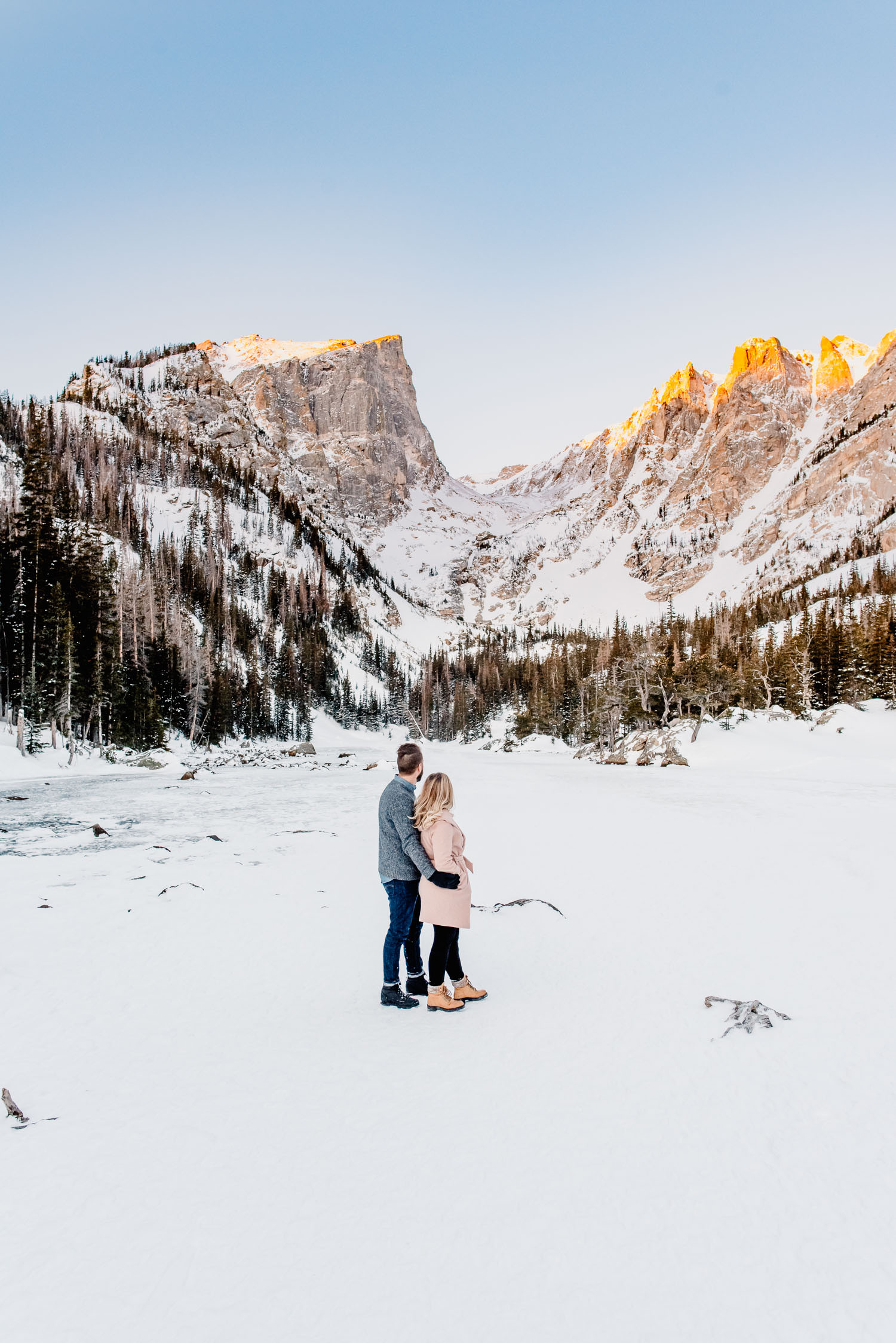 couple at dream lake in winter
