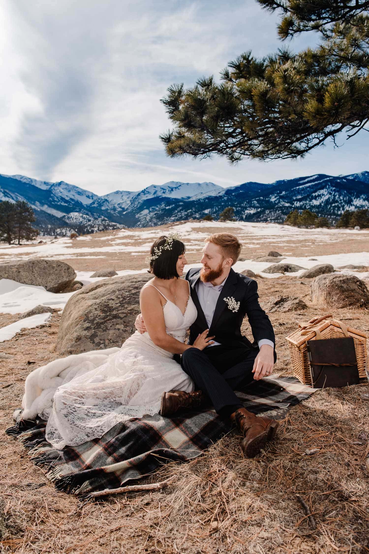 couple enjoying mountain wedding picnic at moraine meadows