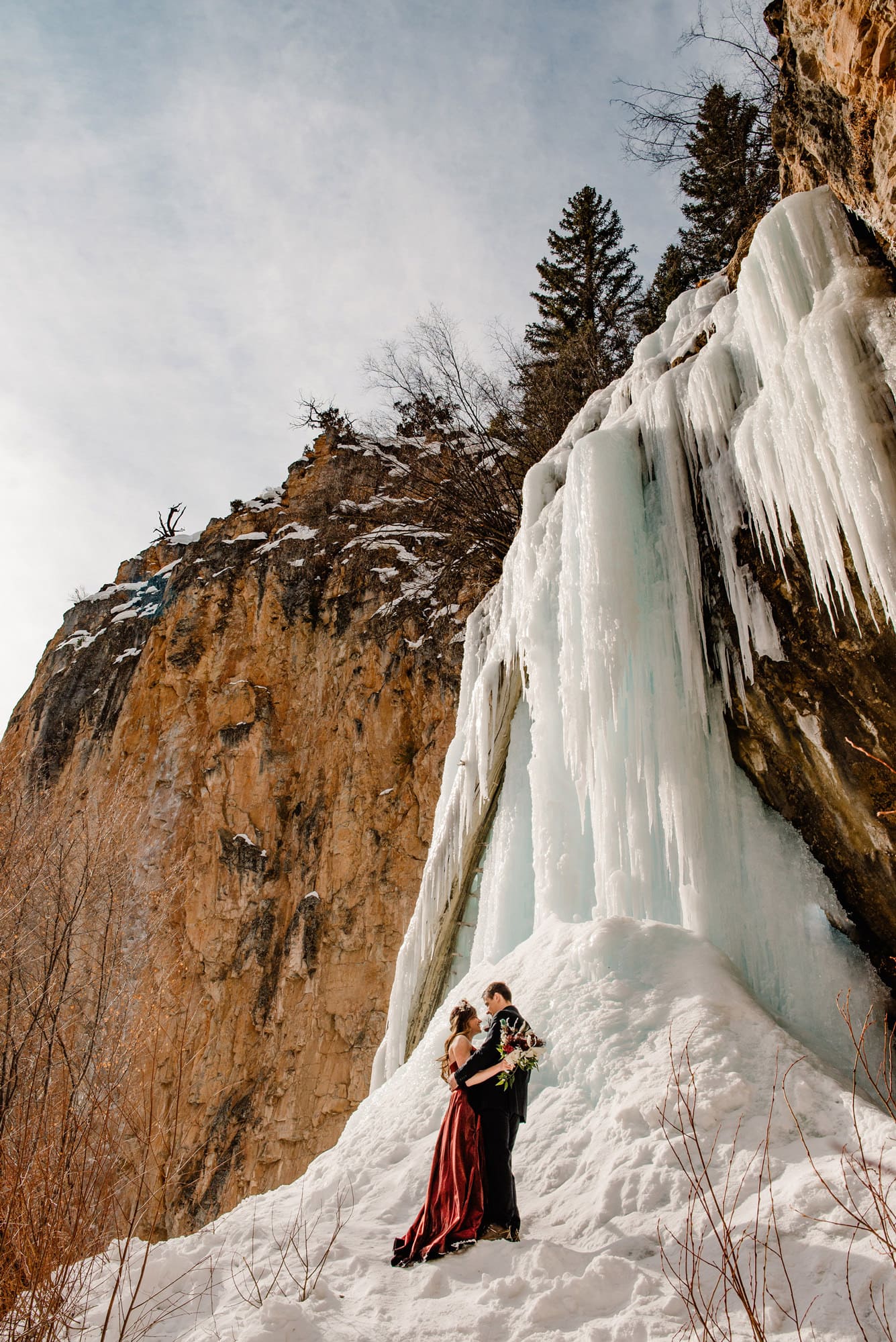couple in front of an ice cave