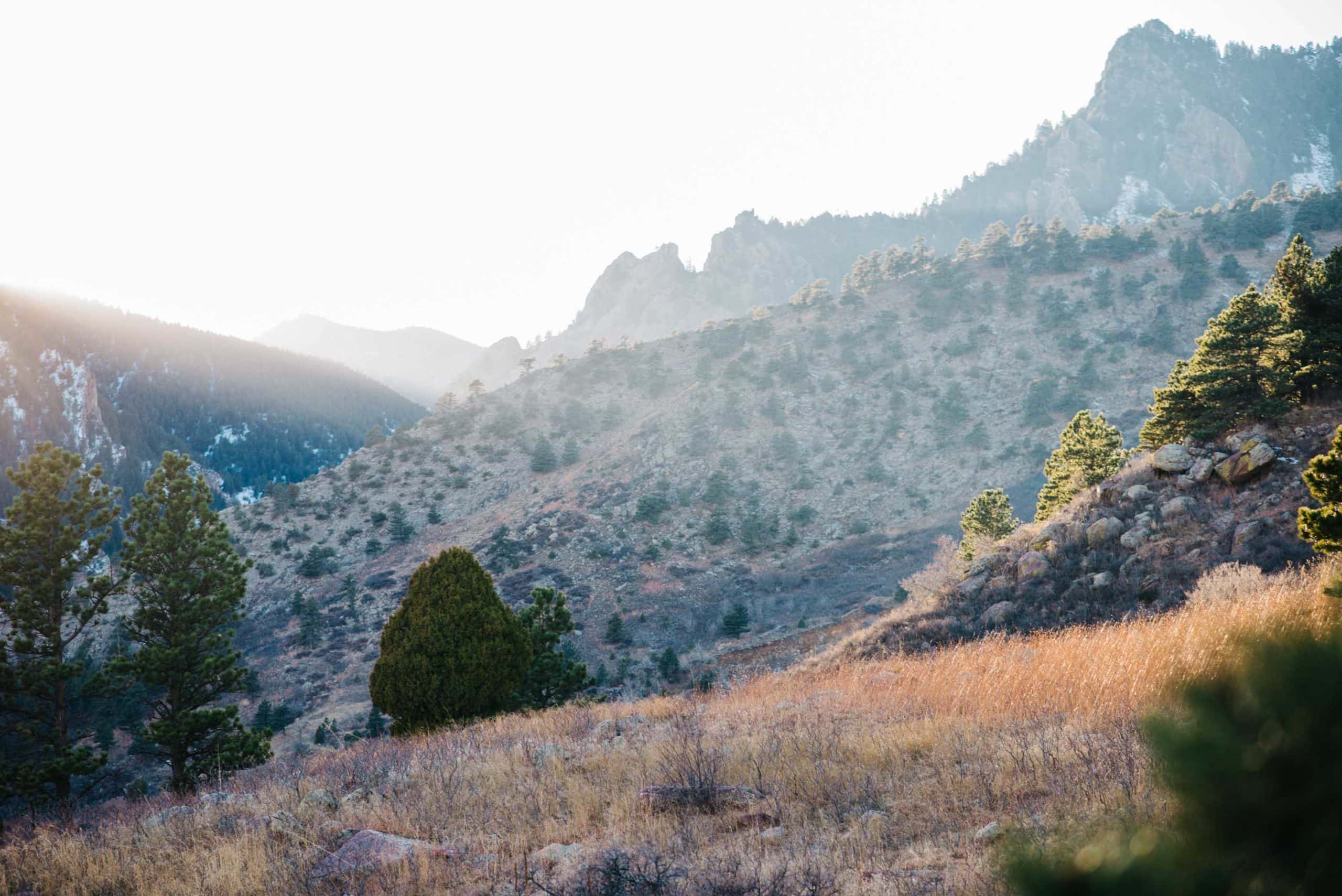 sun sneaking through the mountains