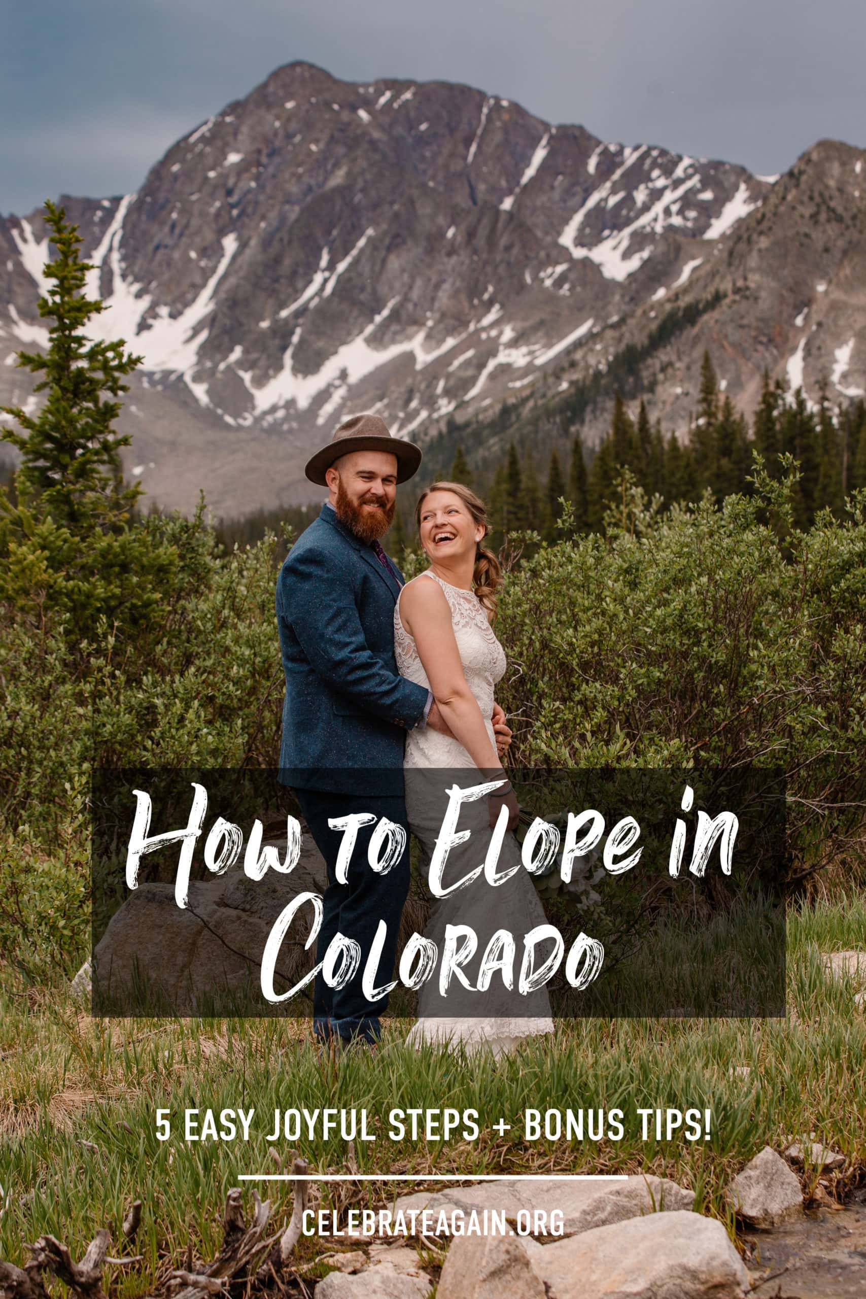 couple smiling at each other as they elope in colorado