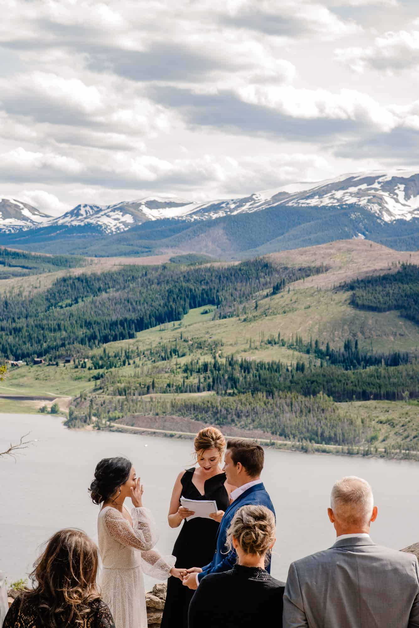 couple enjoying a Breckenridge elopement locations summer wedding on a mountain top