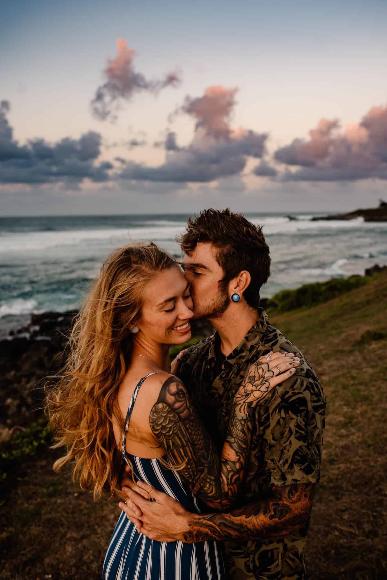 couple snuggling at sunset as they followed the romantic things to do in maui list