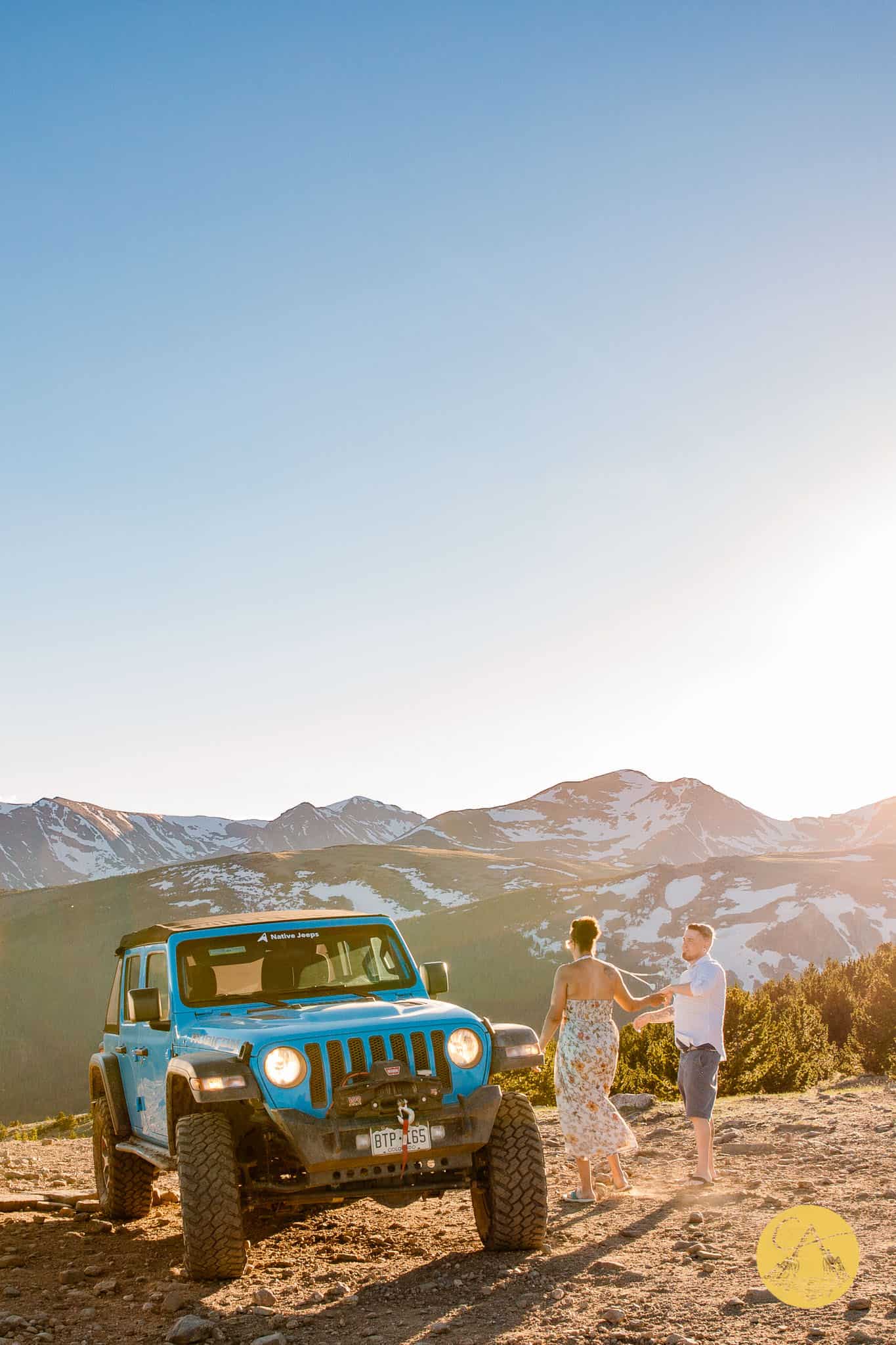 couple dancing on the top of a mountain at their 4x4 wedding in a jeep wrangler