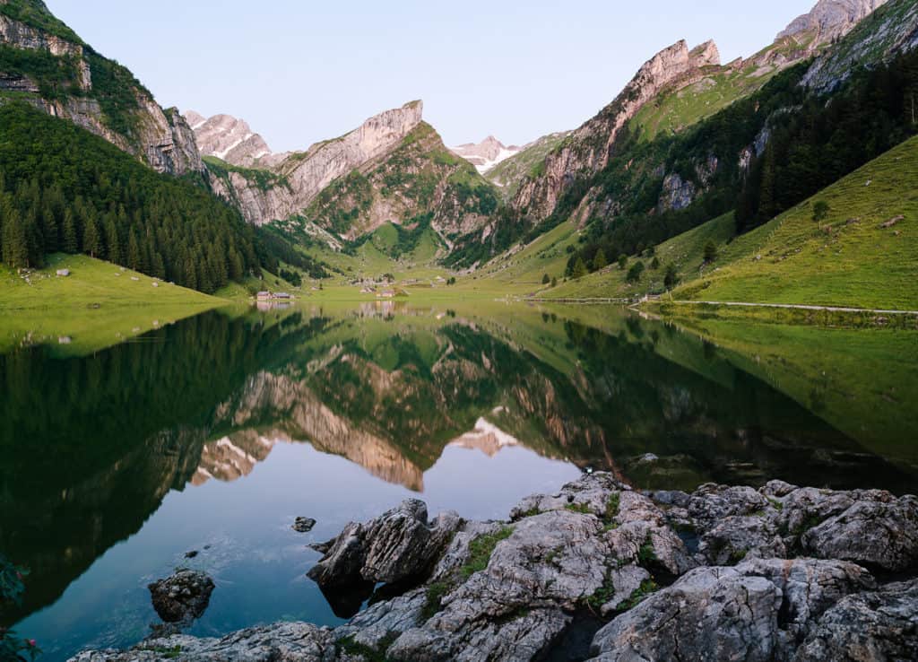 photo of swiss alps an alpine lake reflection