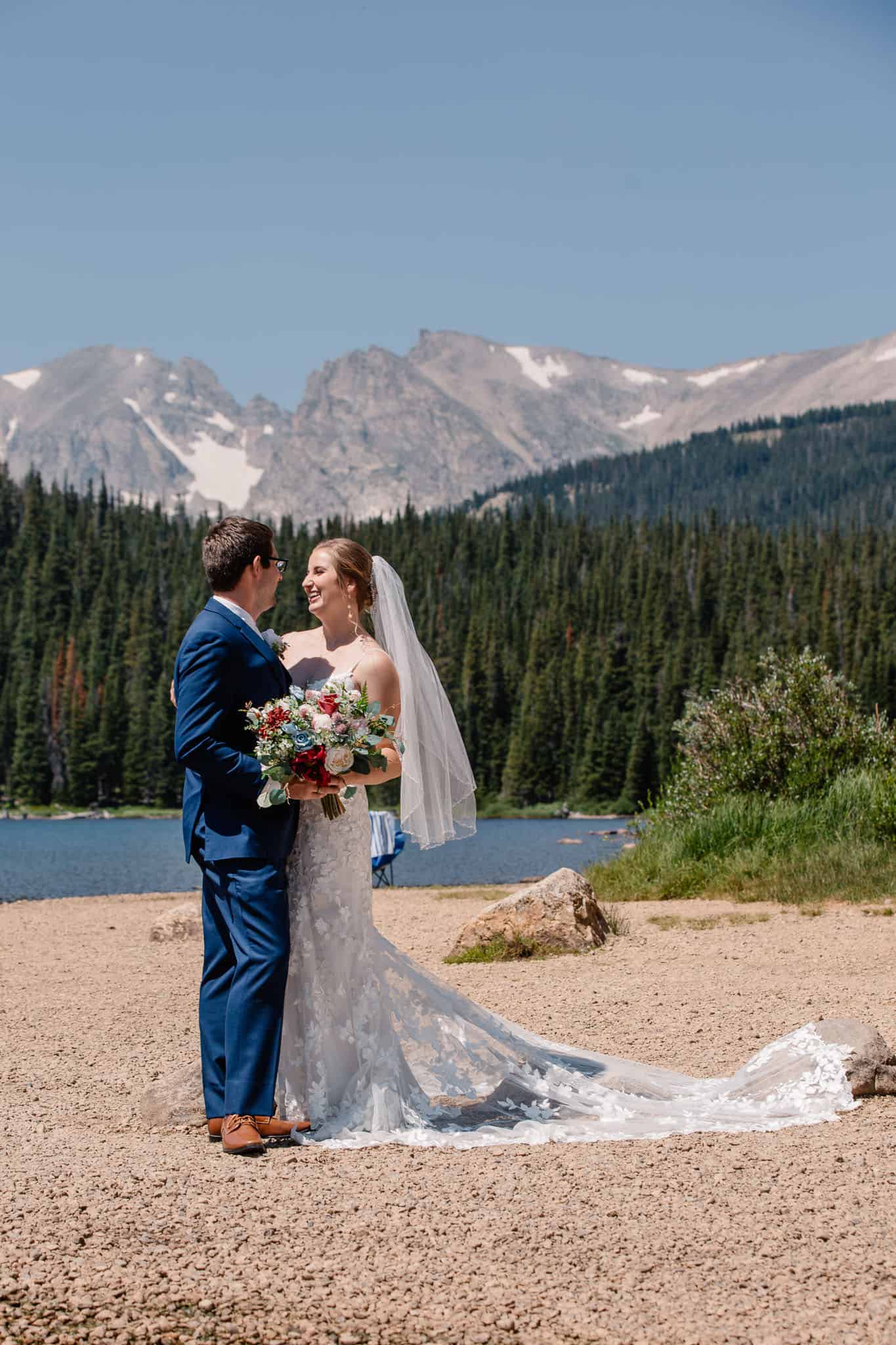 bride and groom hugging at Brianard Lake wedding in Indian Peaks Wilderness