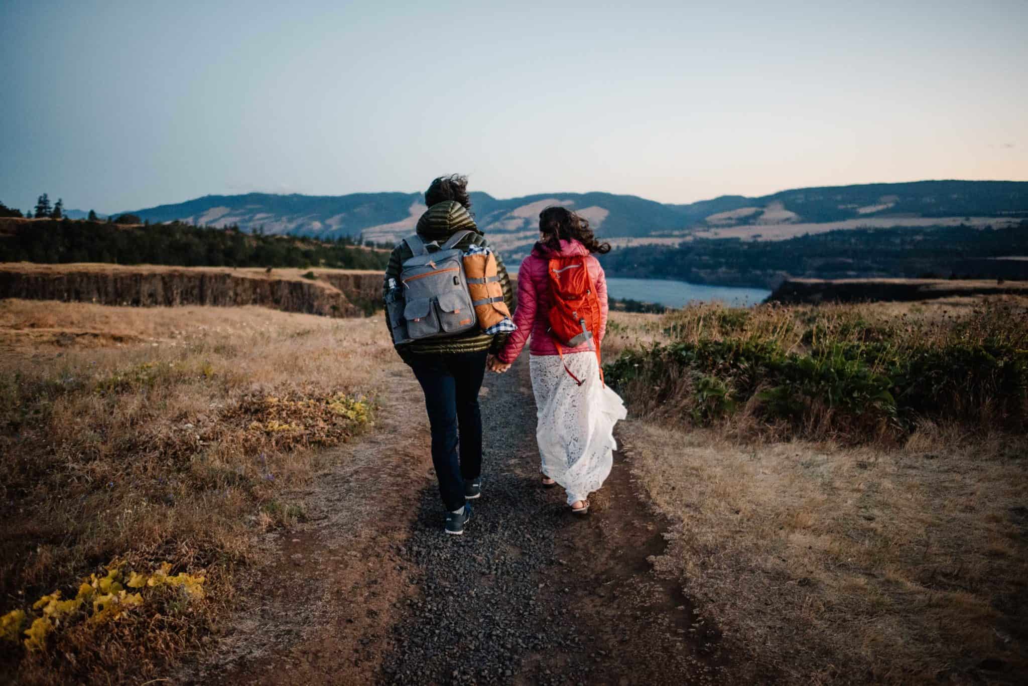 couple walking on a trail practicing leave no trace