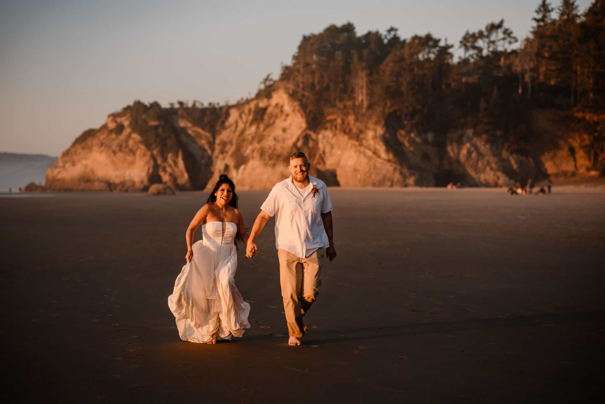 After choosing their favorite elopement locations Couple explores Hug Point after their elopement during sunset