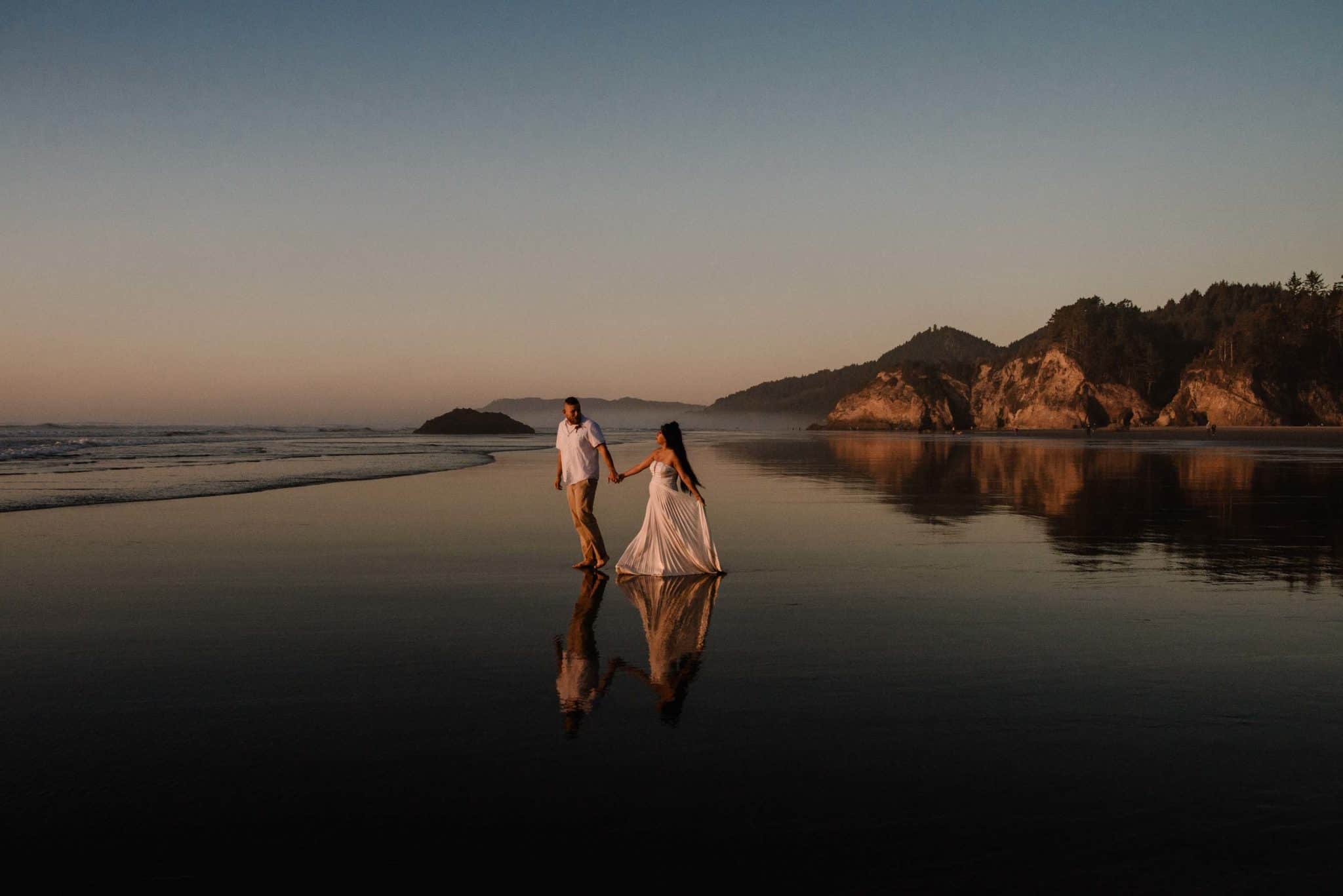 After choosing their favorite elopement locations Couple explores Hug Point after their elopement during sunset