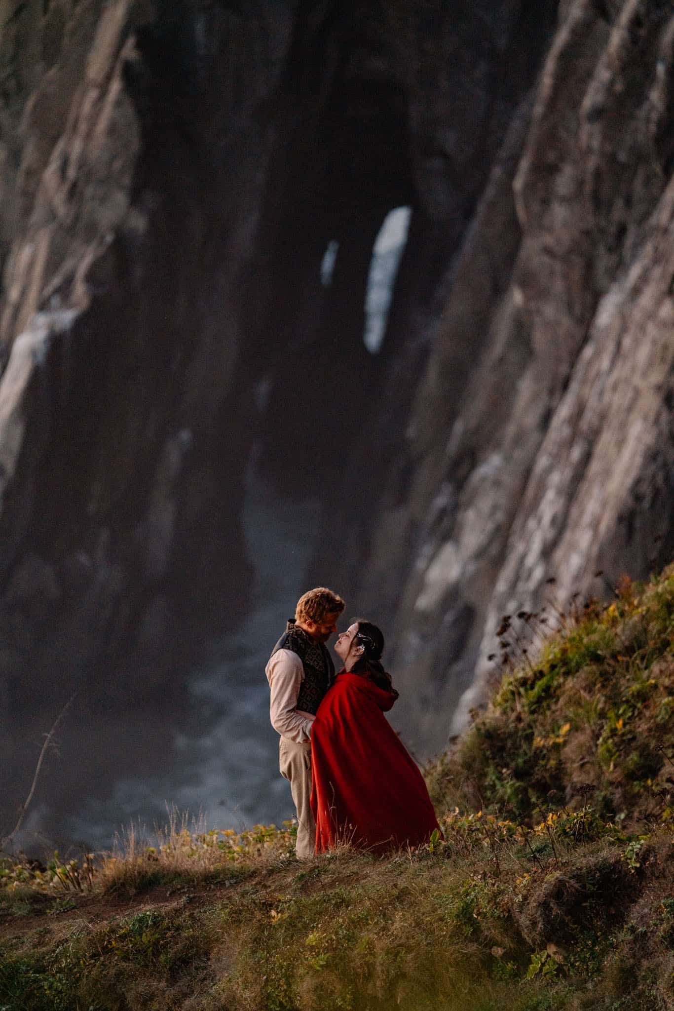 bride and groom on a cliff edge at their Oregon Coast Elopement