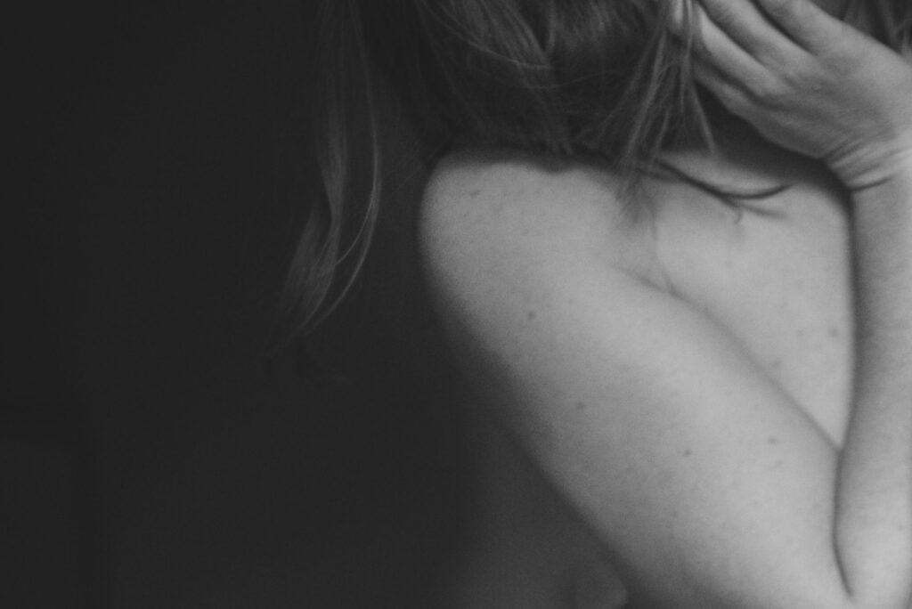 hand touching face softly in black and white photo exploring your own body it is not a sin to explore, empowering sexuality