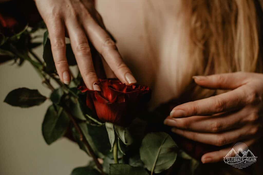 hand touching roses