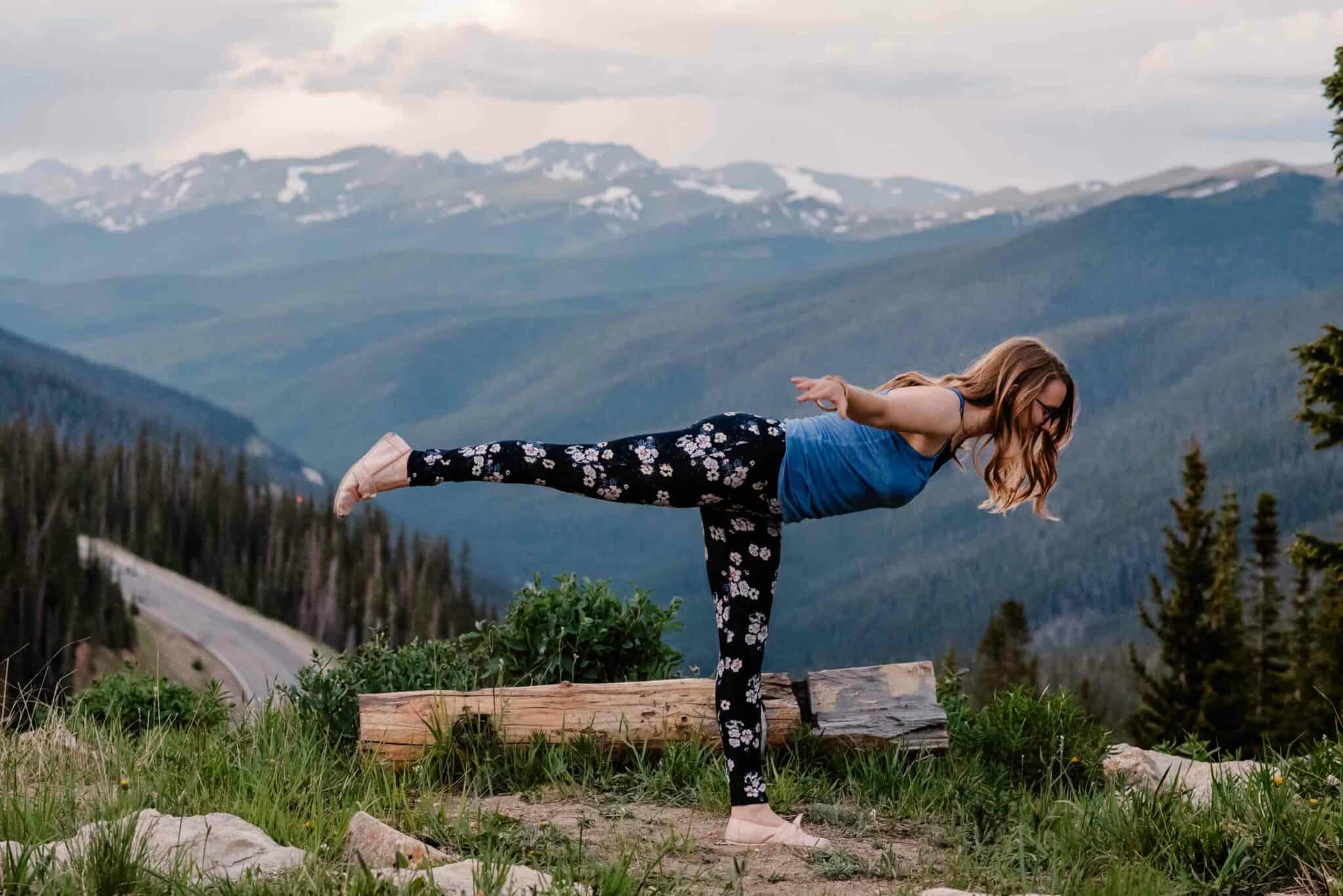 female doing yoga on a mountain top at a wellness retreat in Oregon