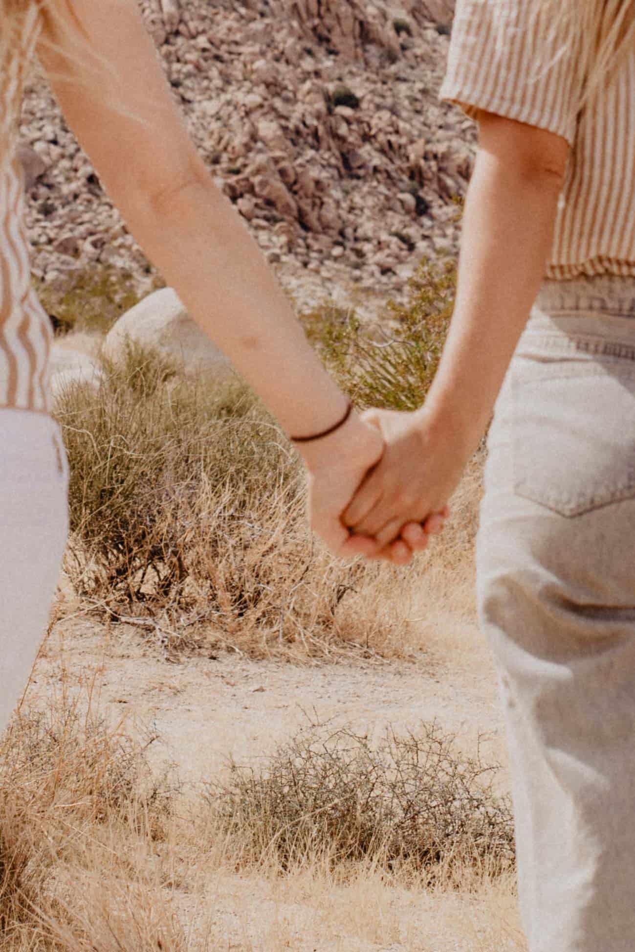 friends holding hands during a women's retreat in Oregon