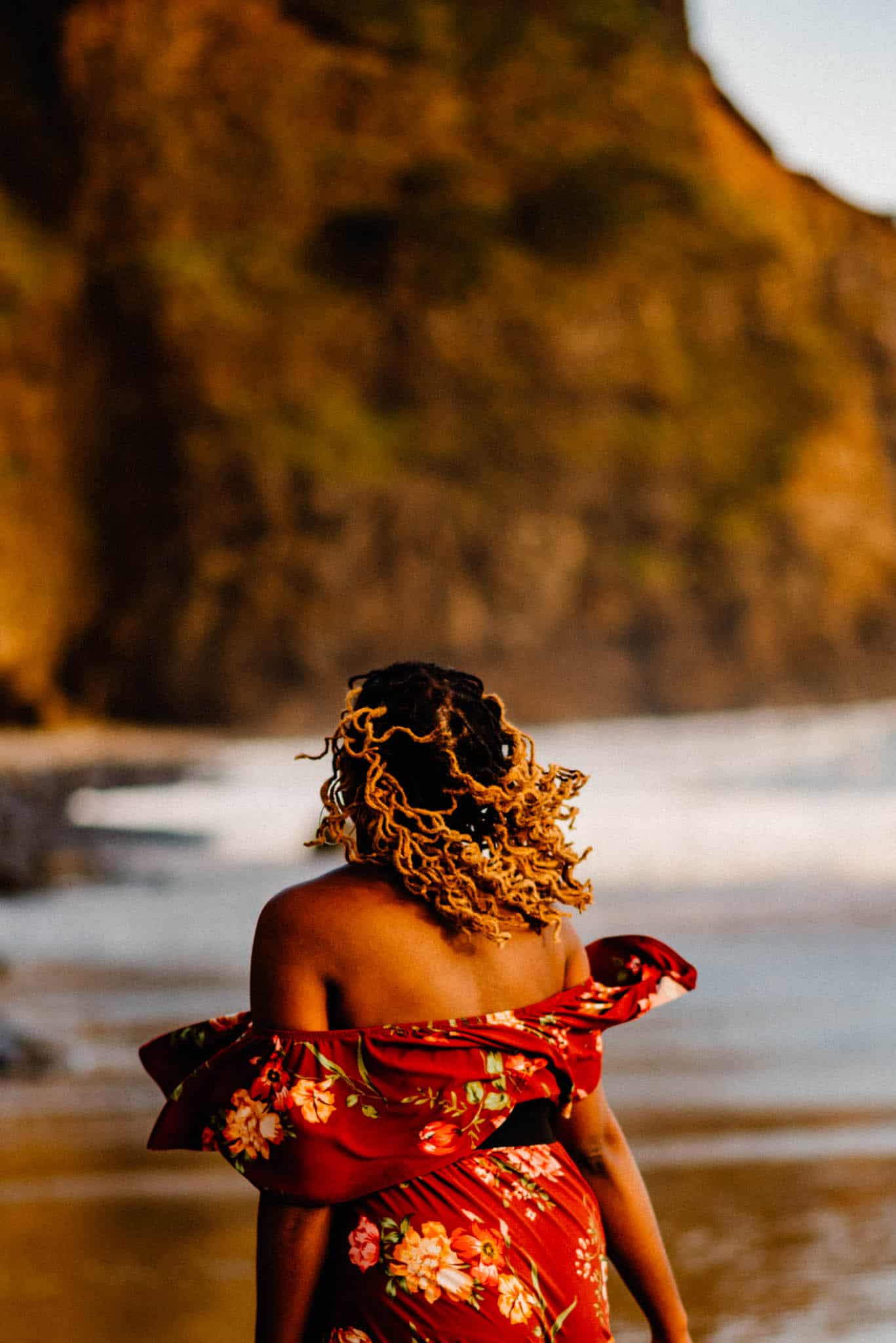 woman at a womans retreat near portland oregon walking on a beach