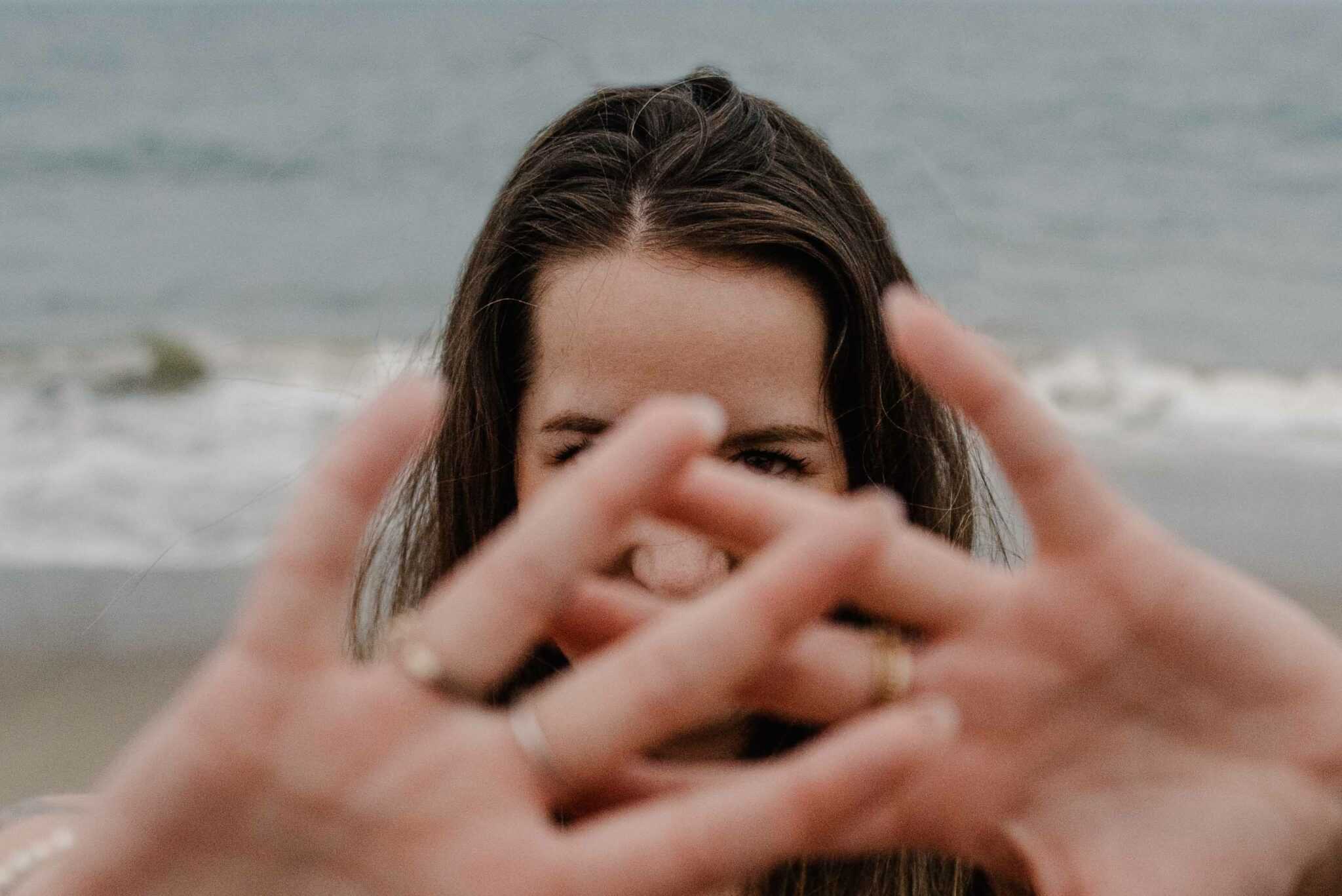 woman holding out her hands during a group womens boudoir photography experience