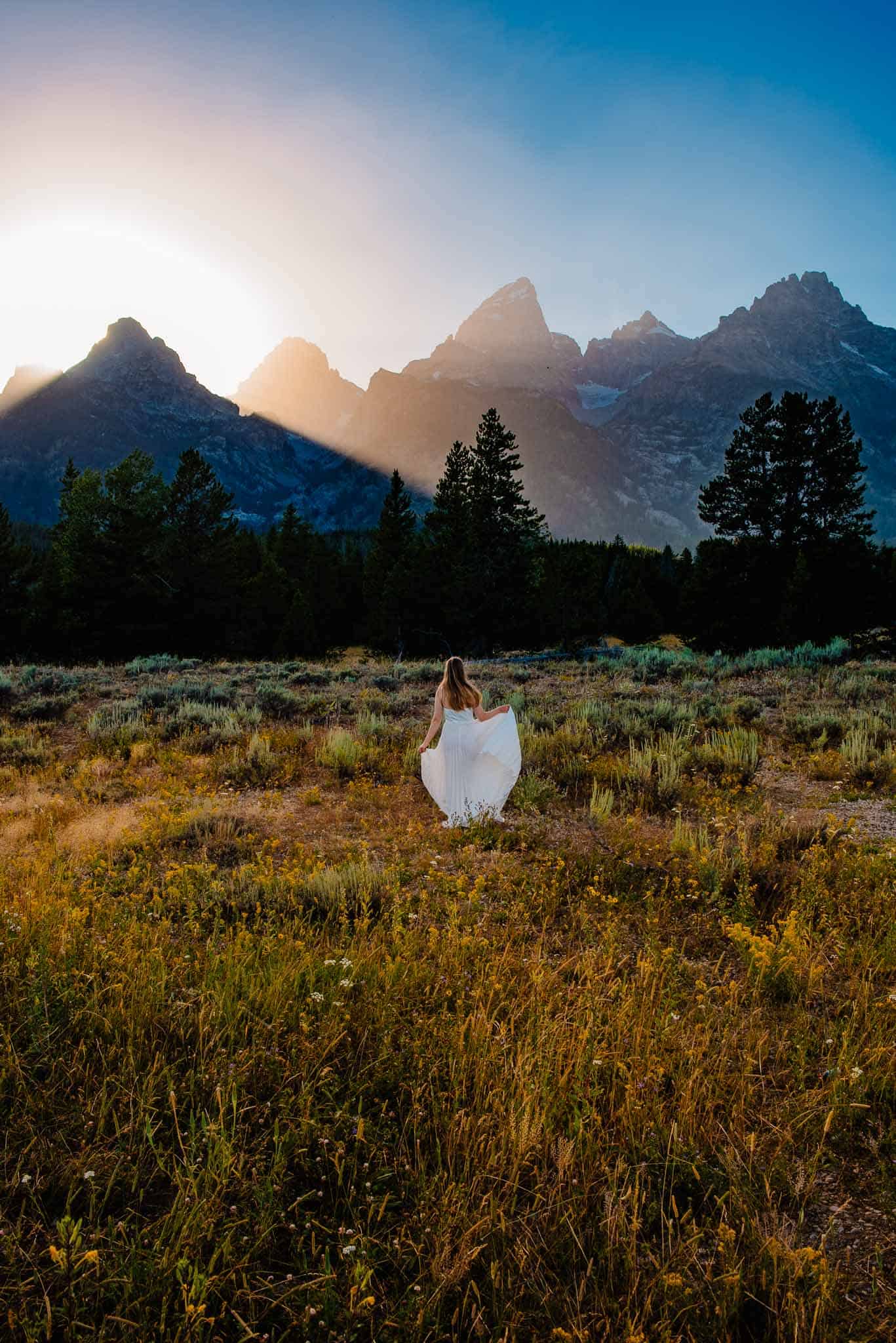 woman in a dress in the mountains