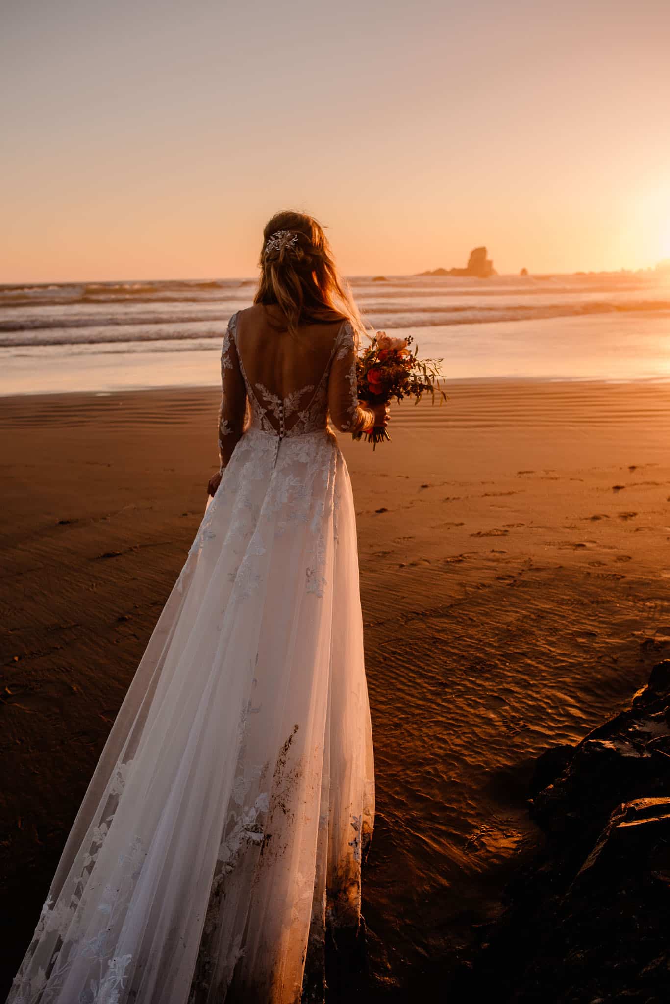 woman wakling towards sunset during a women's themed boudoir photography experience for the goddess divine