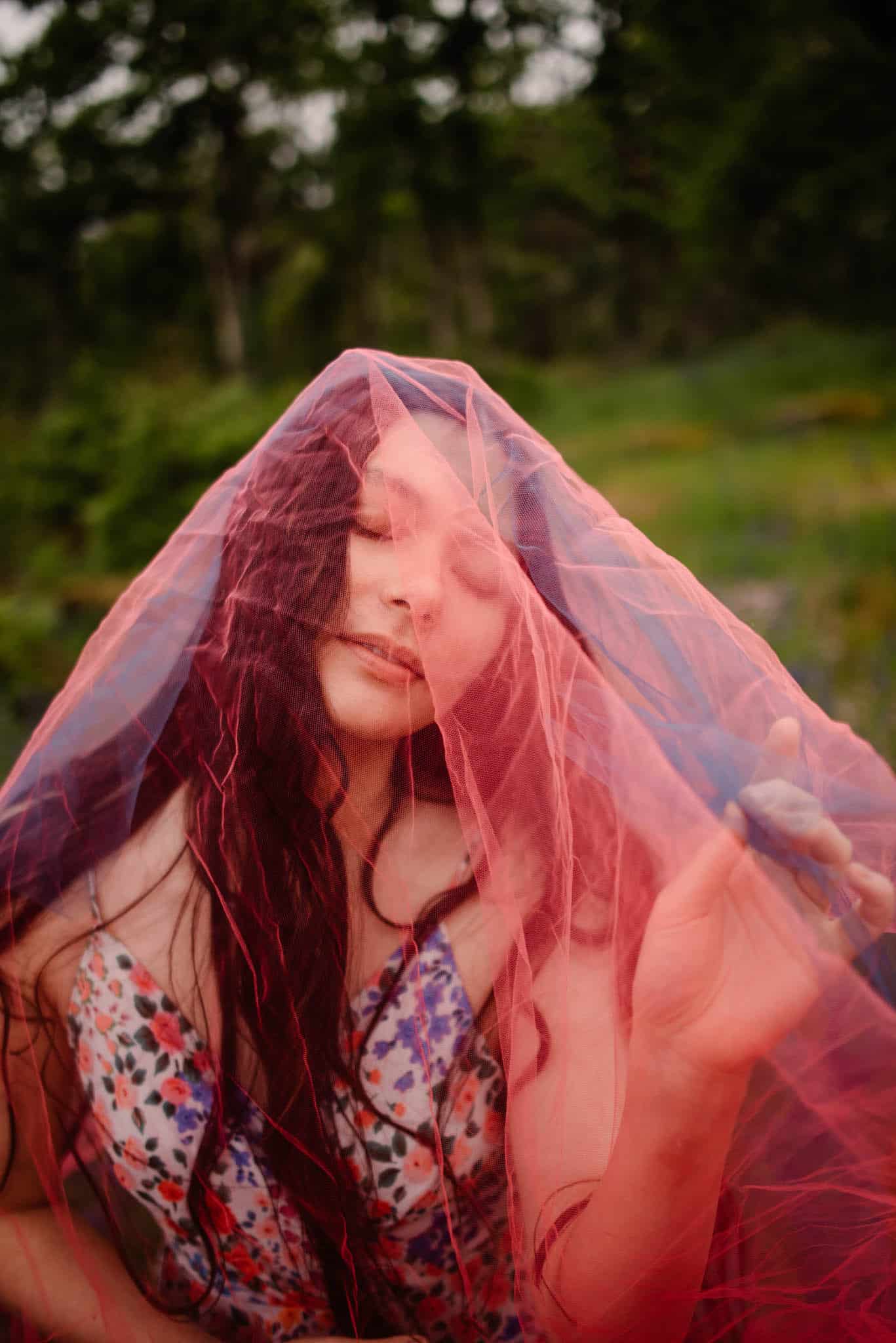 female with a net over her face during a boudoir photography session in Portland, Oregon