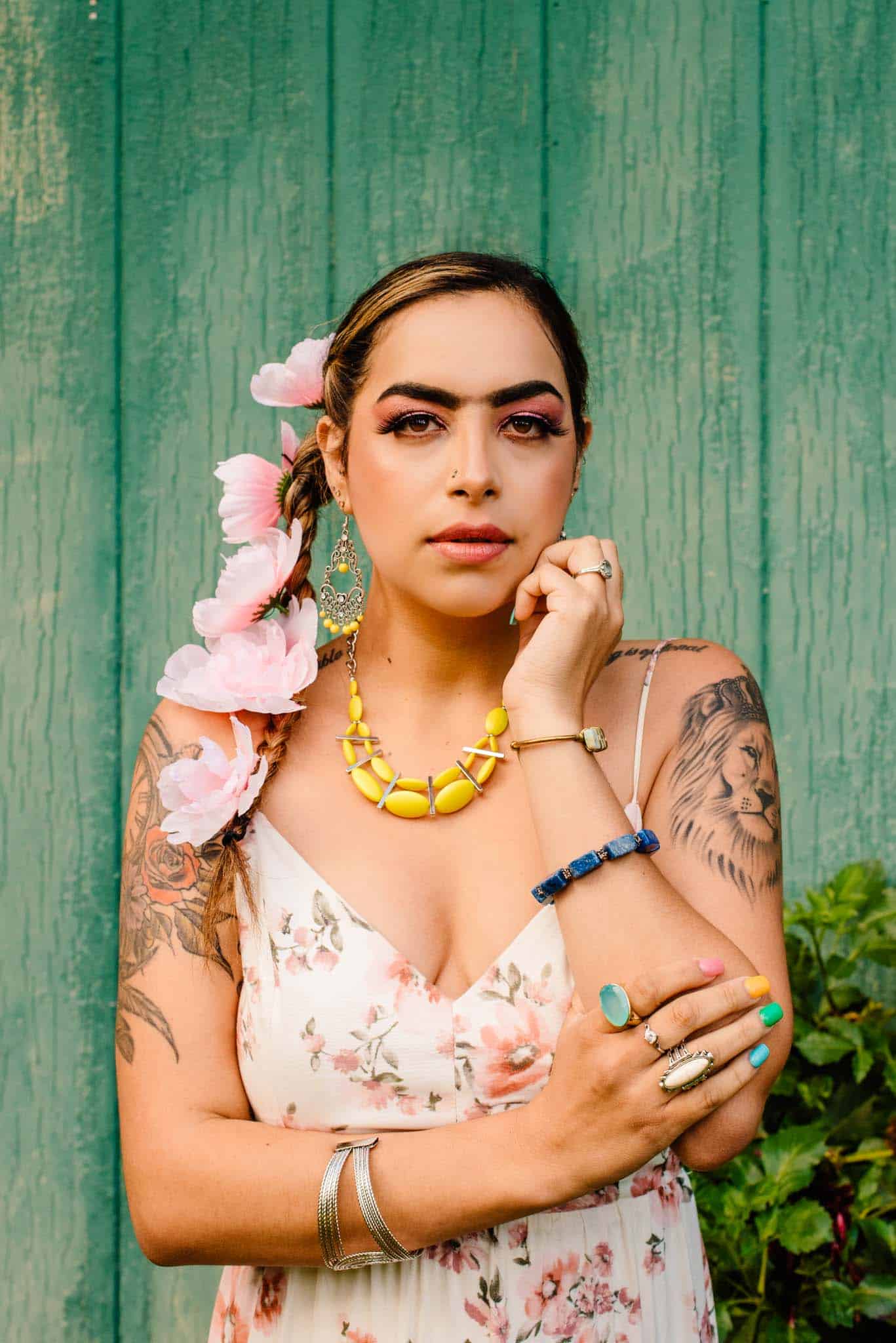 woman dressed like Frida Kahlo with flowers in her hair