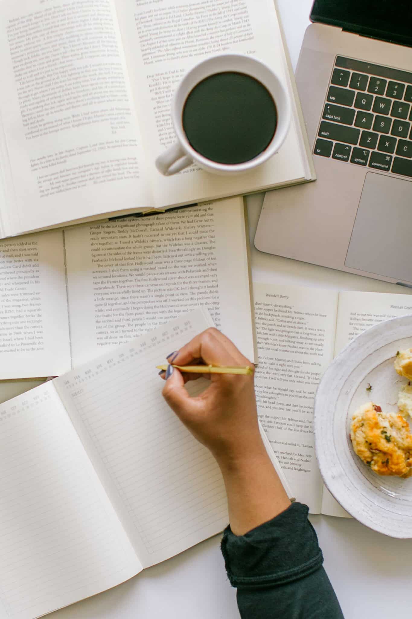 person writing in a journal for a self care idea