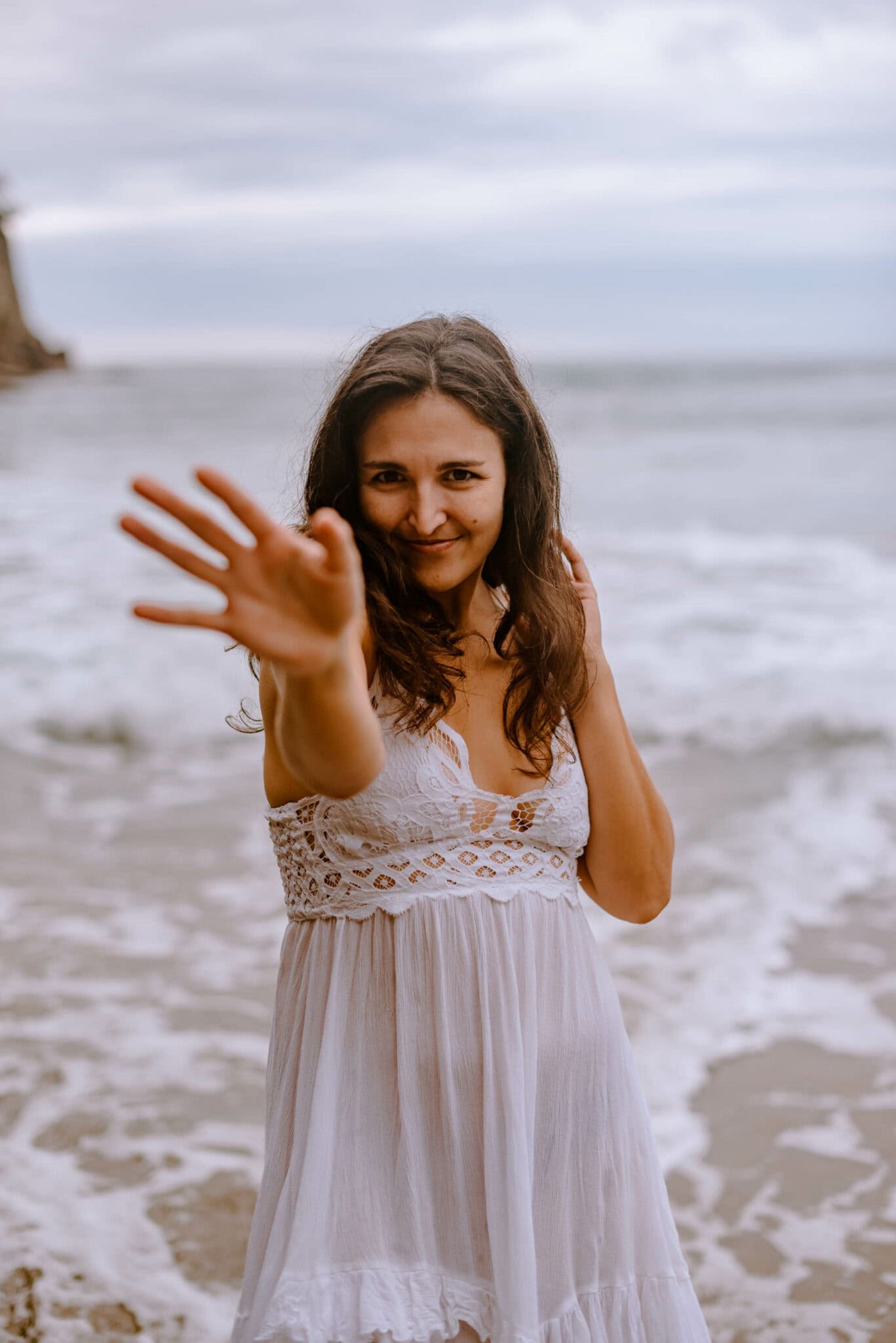 a woman doing somatic movement during a siren archetype womens retreat on the oregon coast