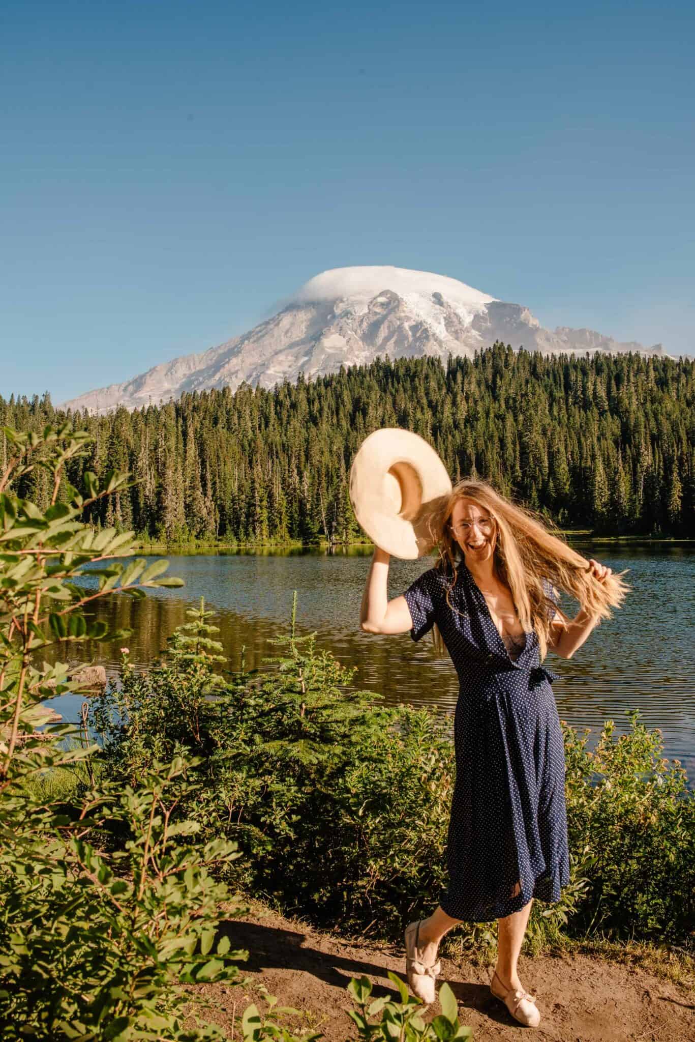 Lumalia sticking her tongue out near an alpine lake