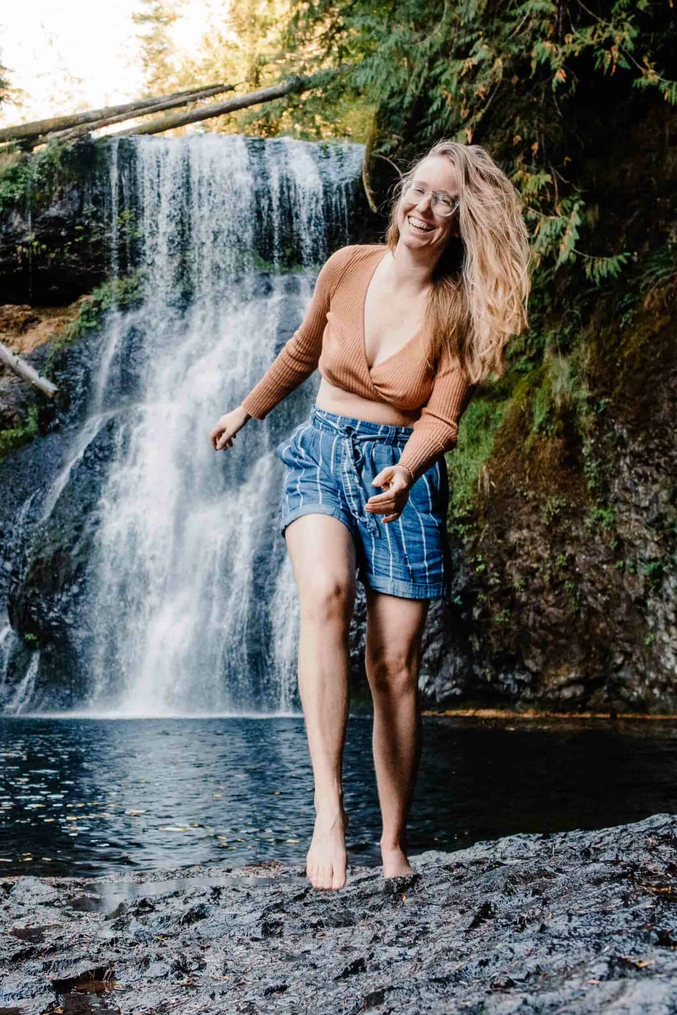 Lumalia smiling front of a waterfall
