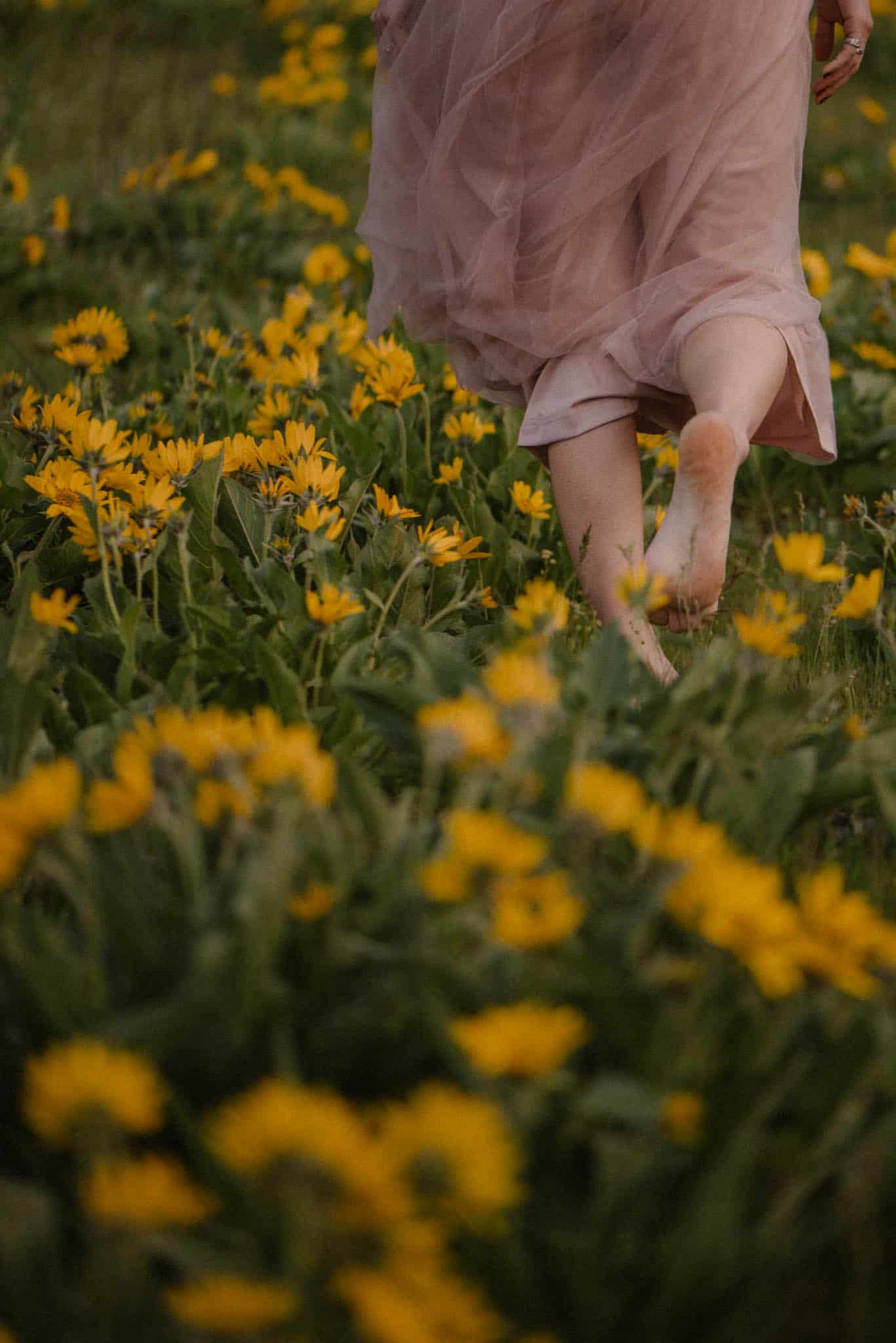 woman walkin barefoot in flowers