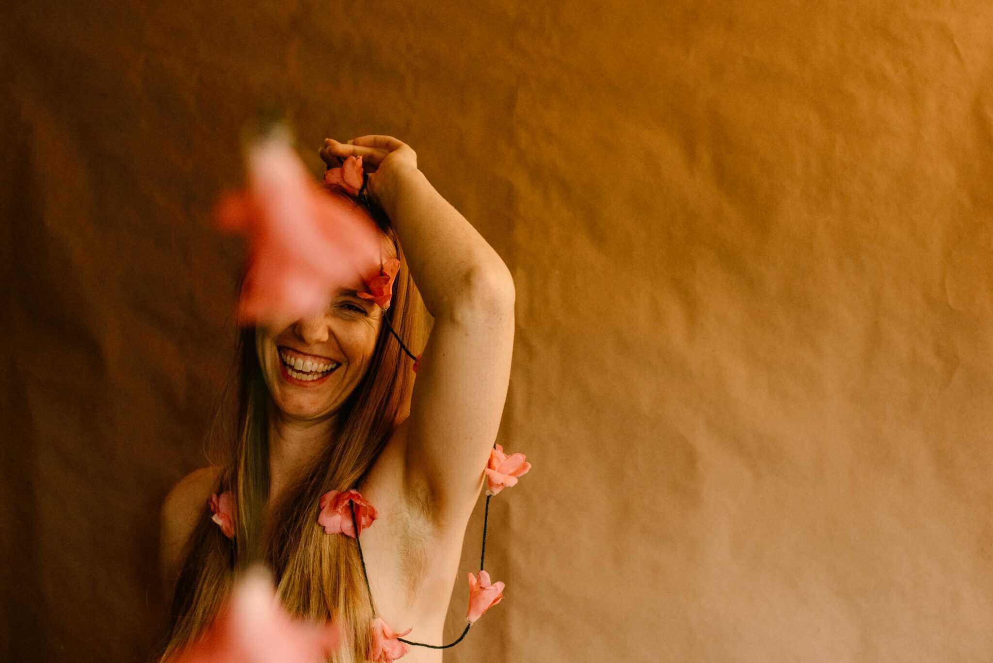 woman holding a camellia on a string in her hands