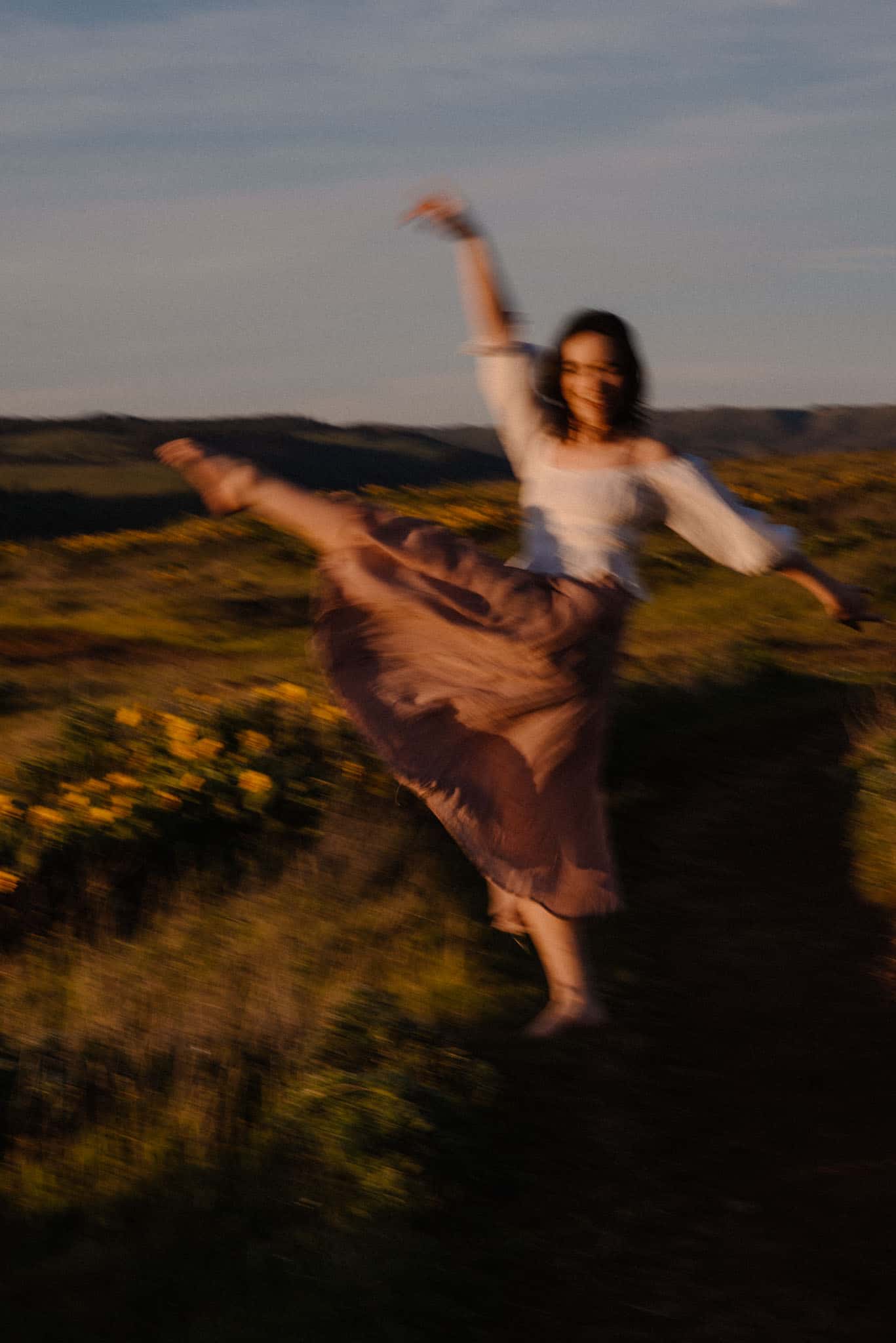 woman kicking her foot up in fieldcontemplating life after self love questions and self love quiz
