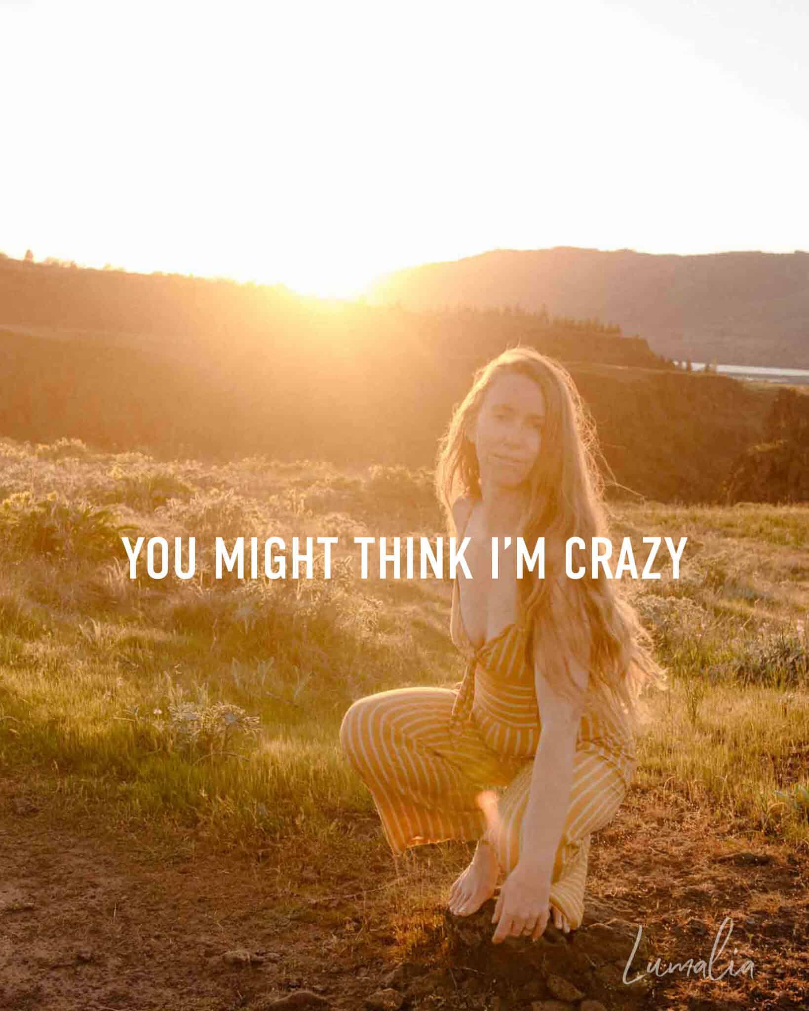 Lumalia talking about healing collective trauma in our stories near a sunset with text that ssays "you might think i'm crazy"