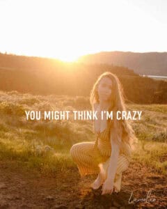 Lumalia talking about healing collective trauma in our stories near a sunset with text that ssays "you might think i'm crazy"