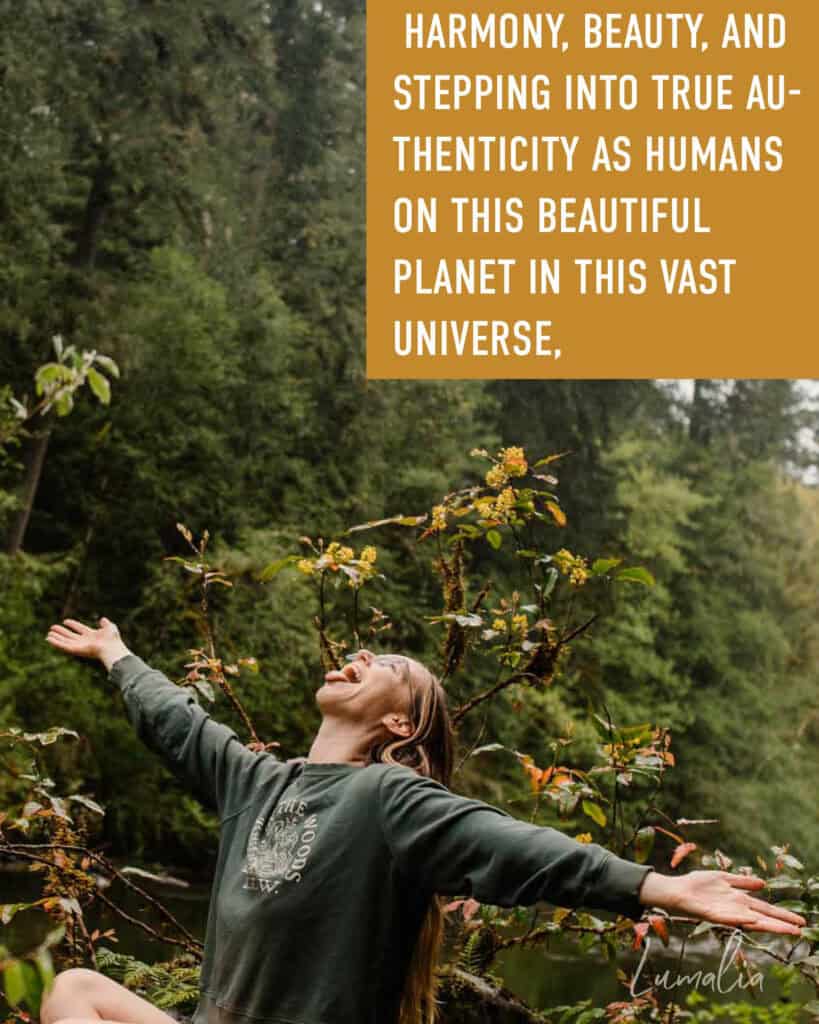 Lumalia talking about healing collective trauma in our stories with arm stretched out wide and text "Harmony, beauty, and stepping into true authenticity as humans on this beautiful planet in this vast universe, "