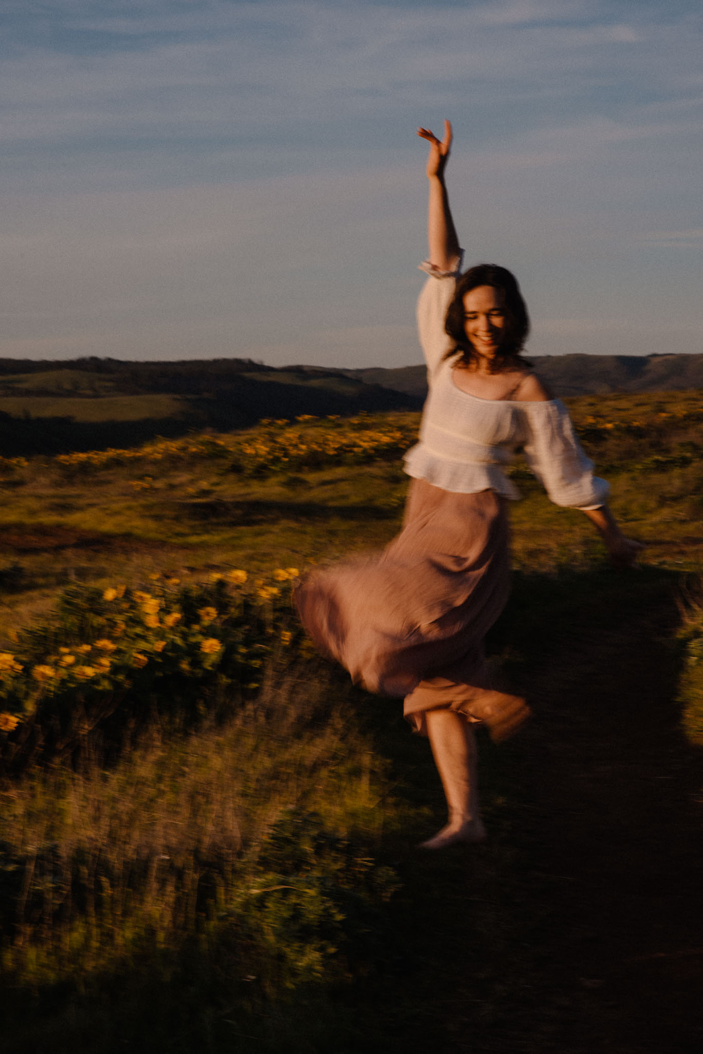 woman spinning kicking her arms up