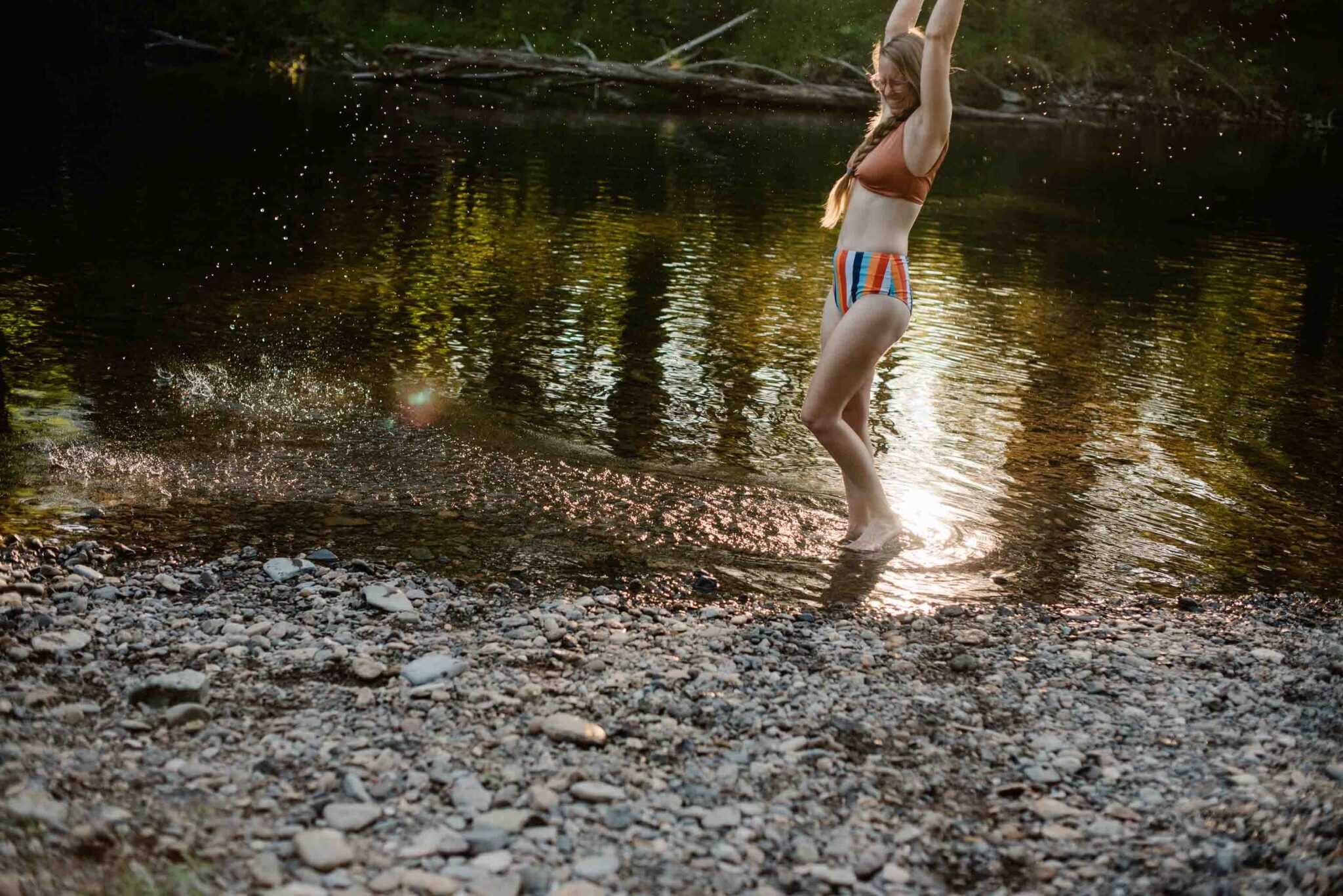Lumalia splashing in water near a river taking leaders off pedestals