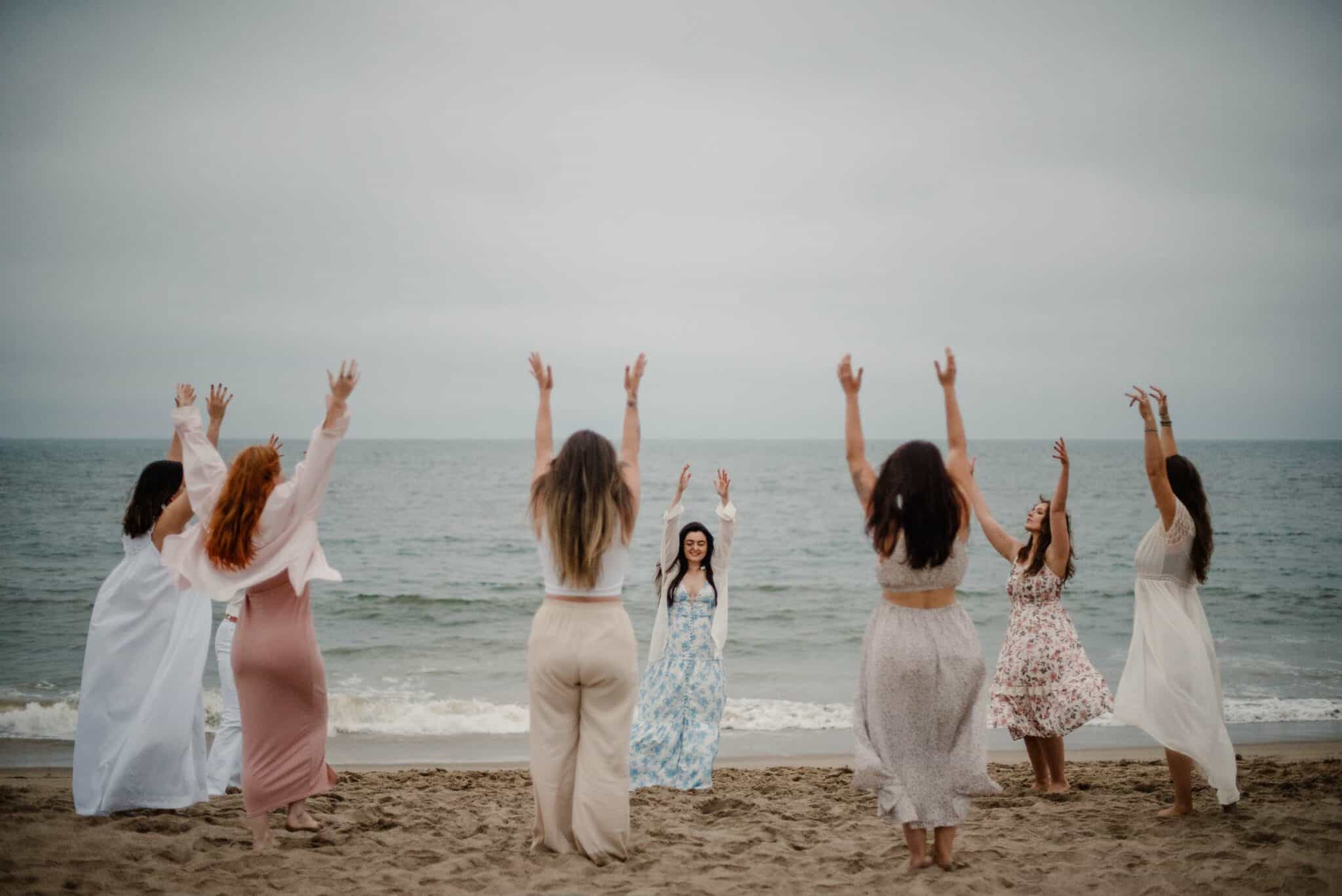 women gathering on a beach