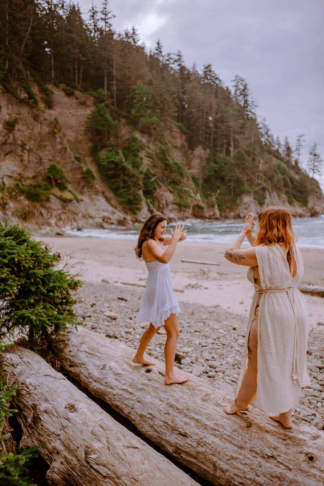 women on a log doing somatic work