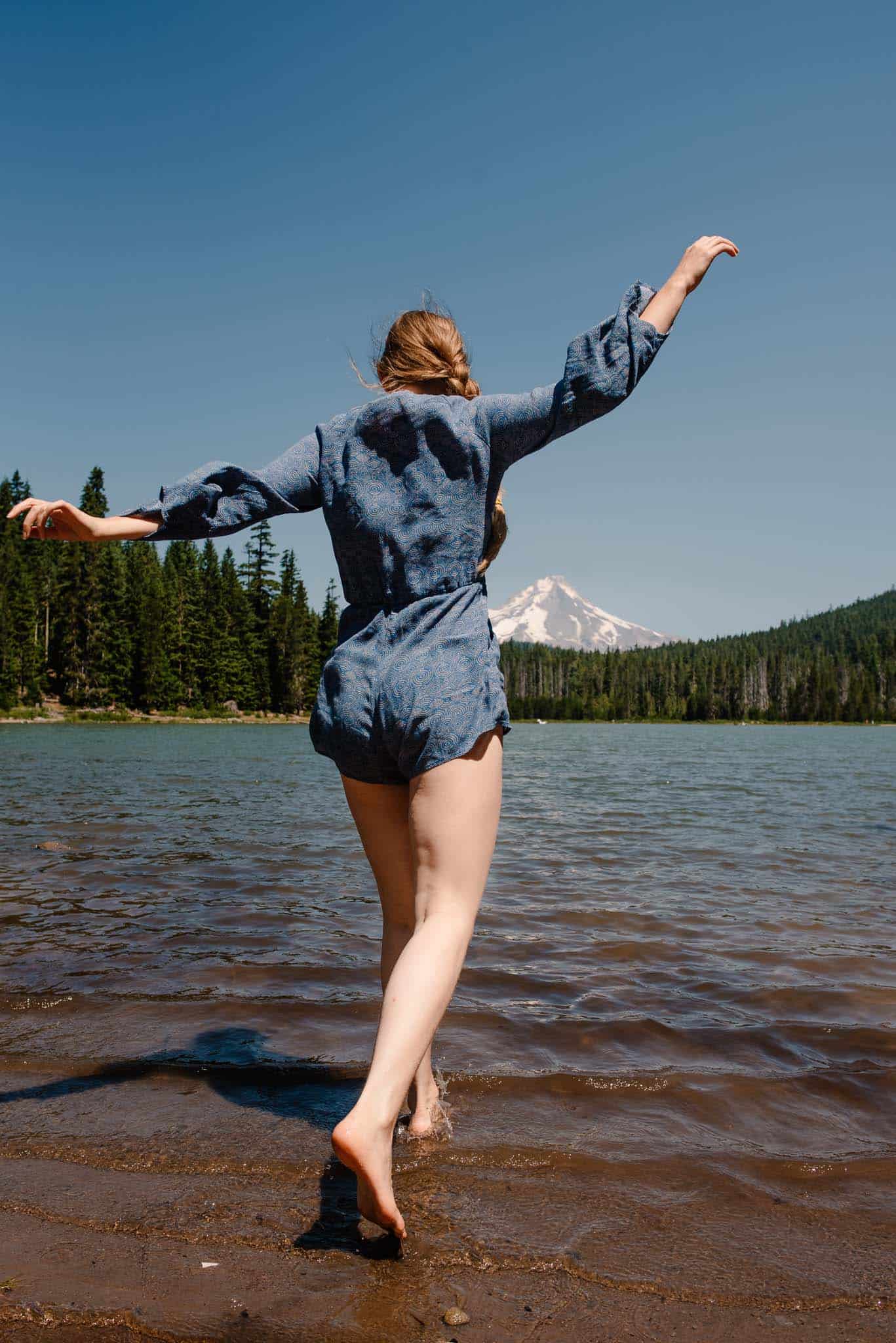 woman playing near alpine lake after being told she was no longer attractive