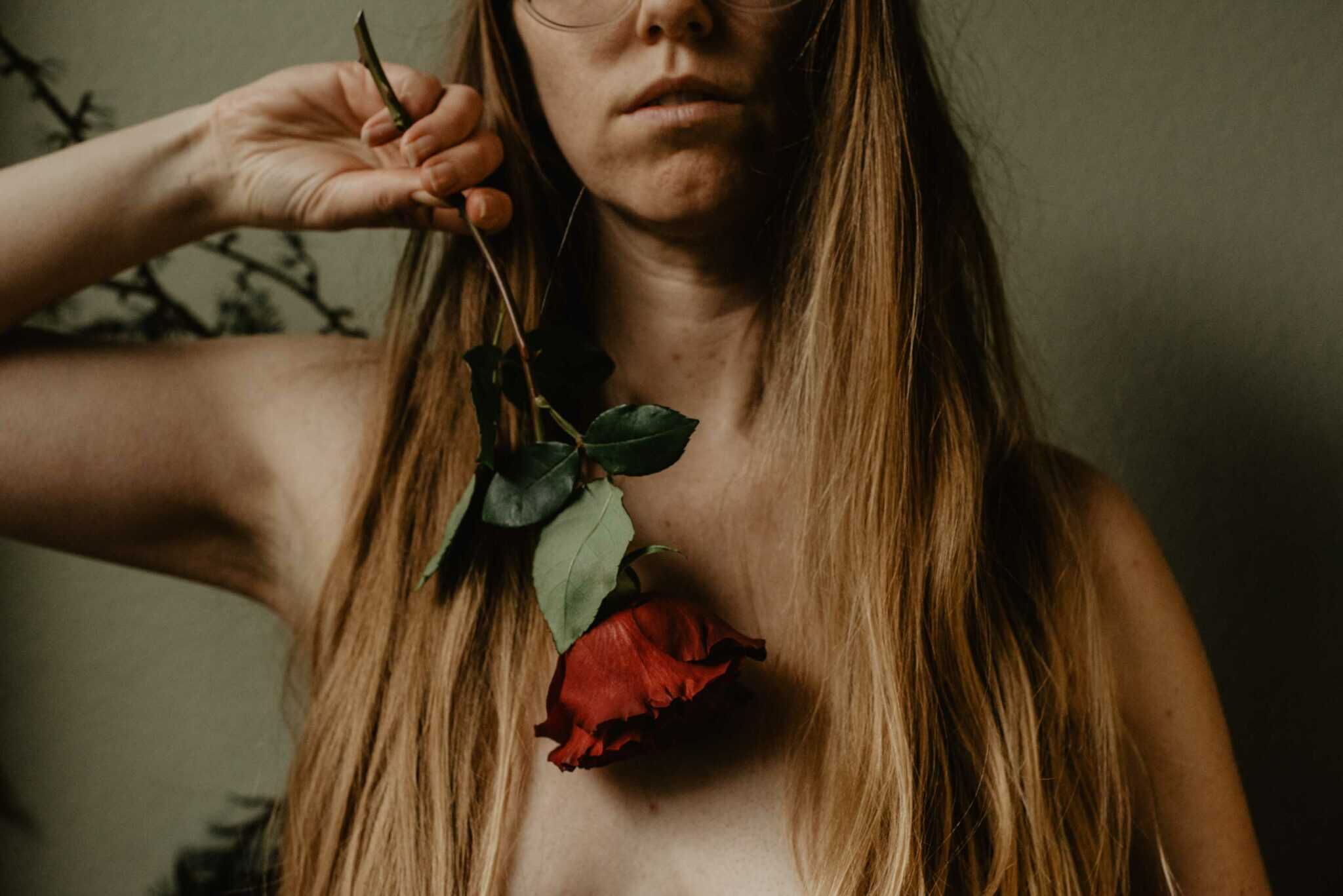 a woman with a rose on her chest From Roses to Mary Magdalene: The Secret of Everyday Awe