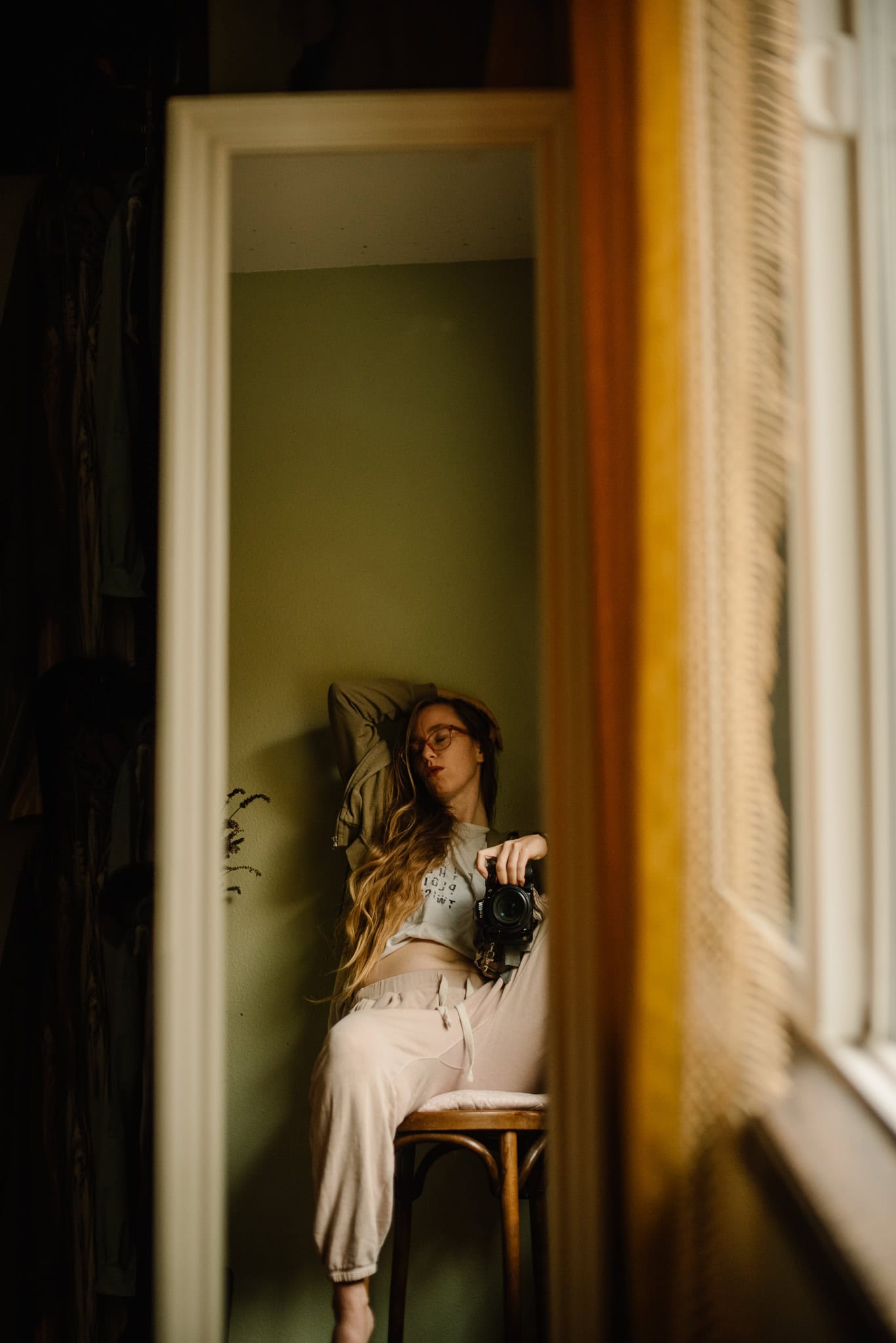 Lumalia on a chair photogrpahign her self letting the mystery be her muse for an experience inside House of Bliss